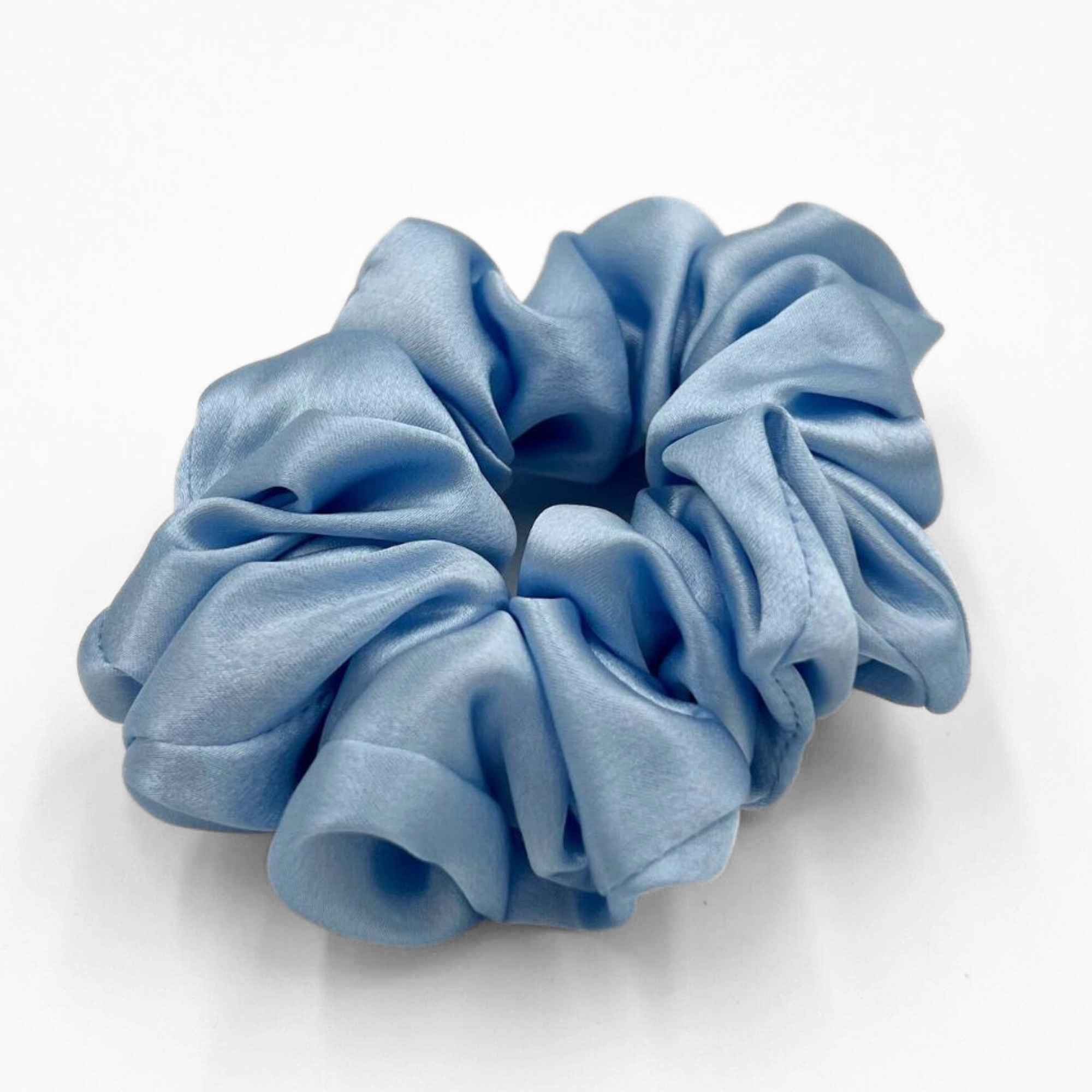 baby blue mulberry silk scrunchie on a white background