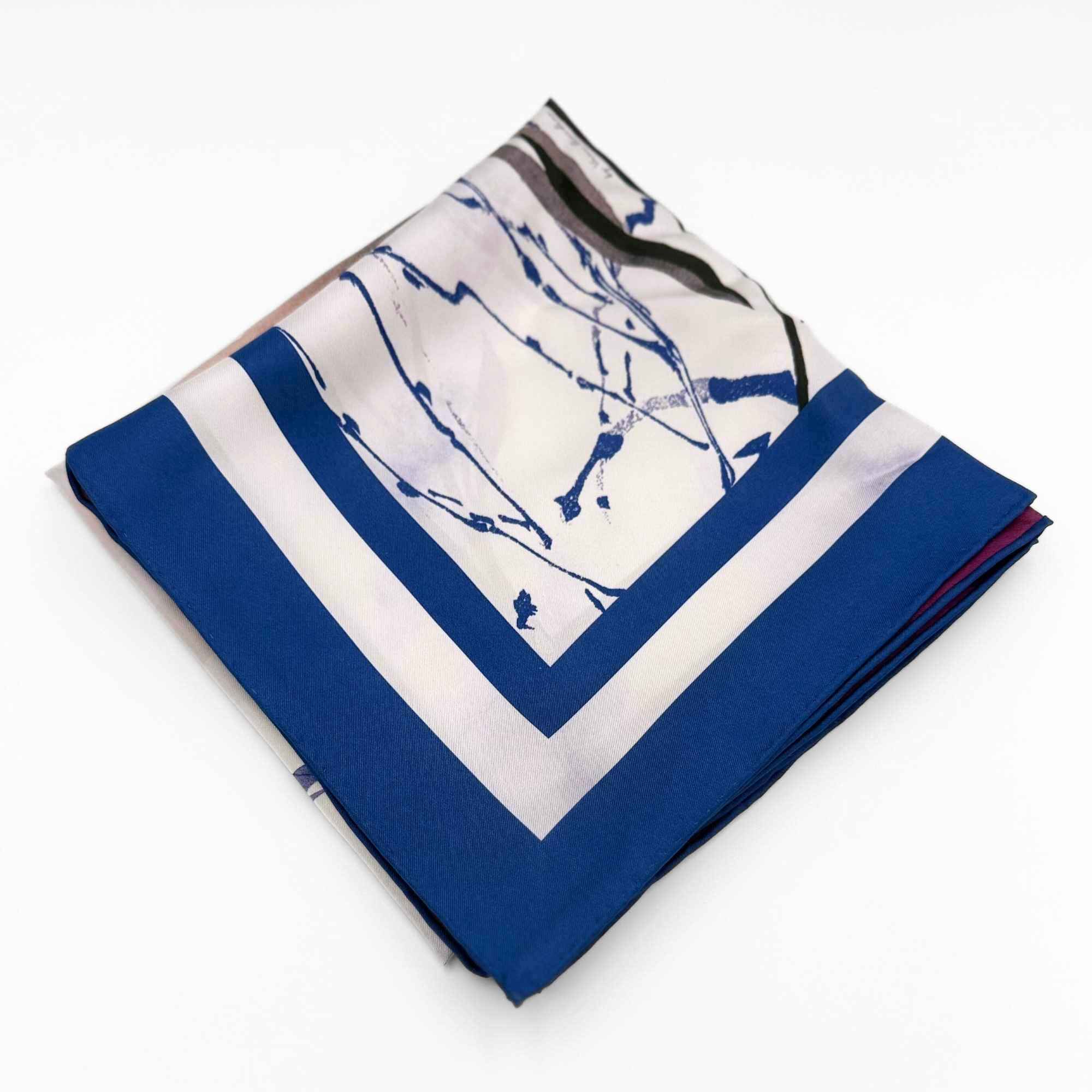 Folded 'Beautiful Botanicals' silk twill scarf on a white background