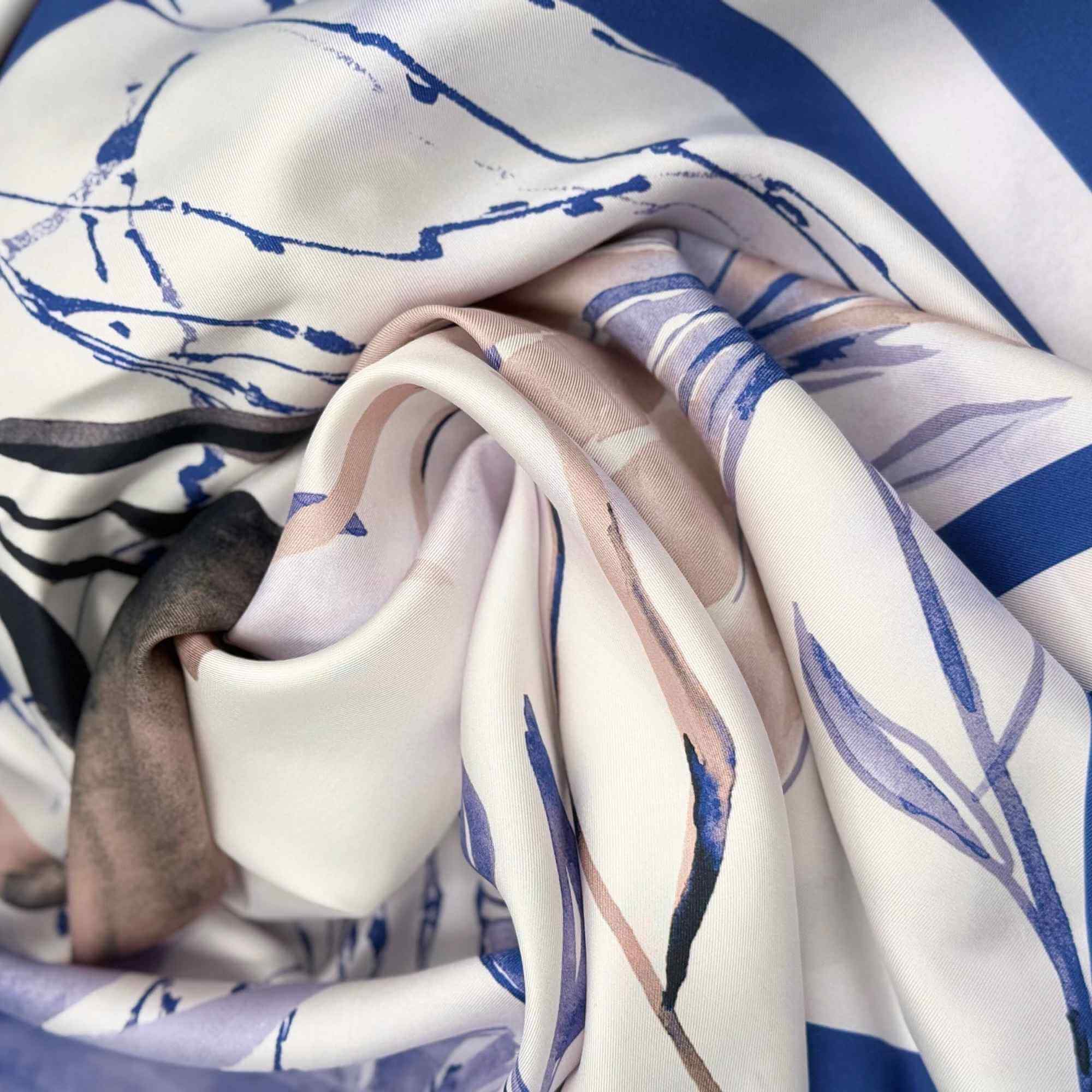 Close-up of a silk twill scarf with blue and white floral pattern