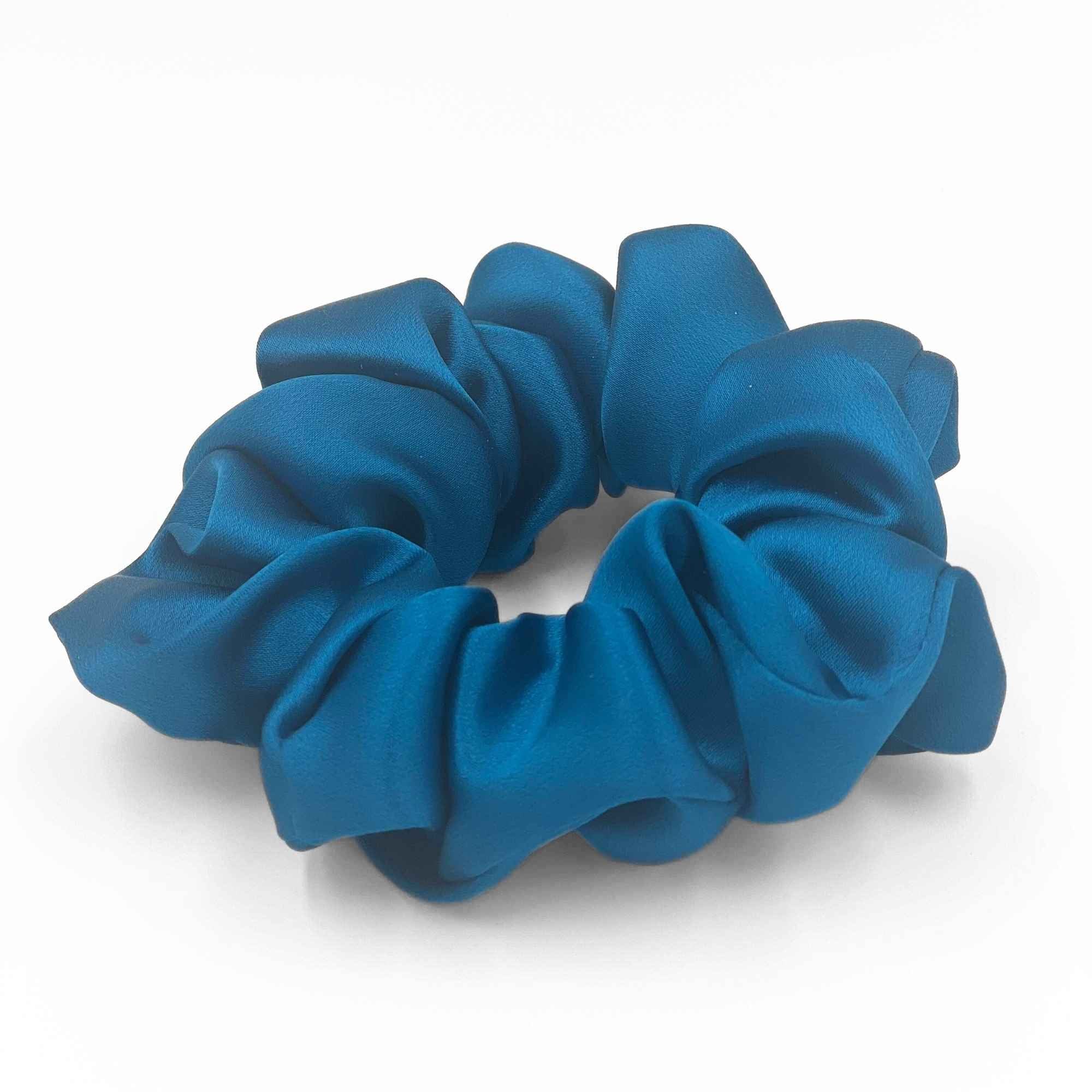 crystal teal mulberry silk scrunchie on a white background