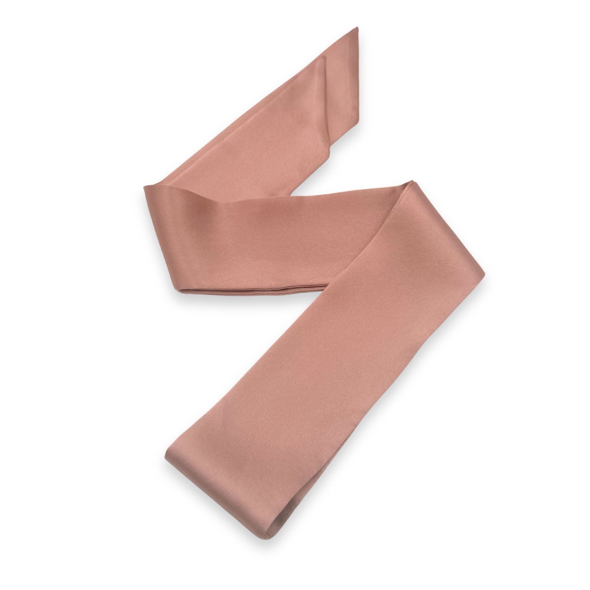 a dusty rose silk skinny scarf on a white background
