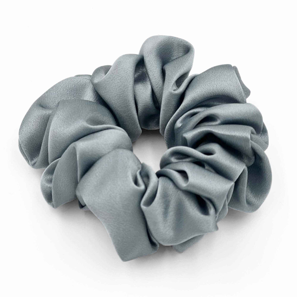 dusty blue mulberry silk scrunchie on a white background