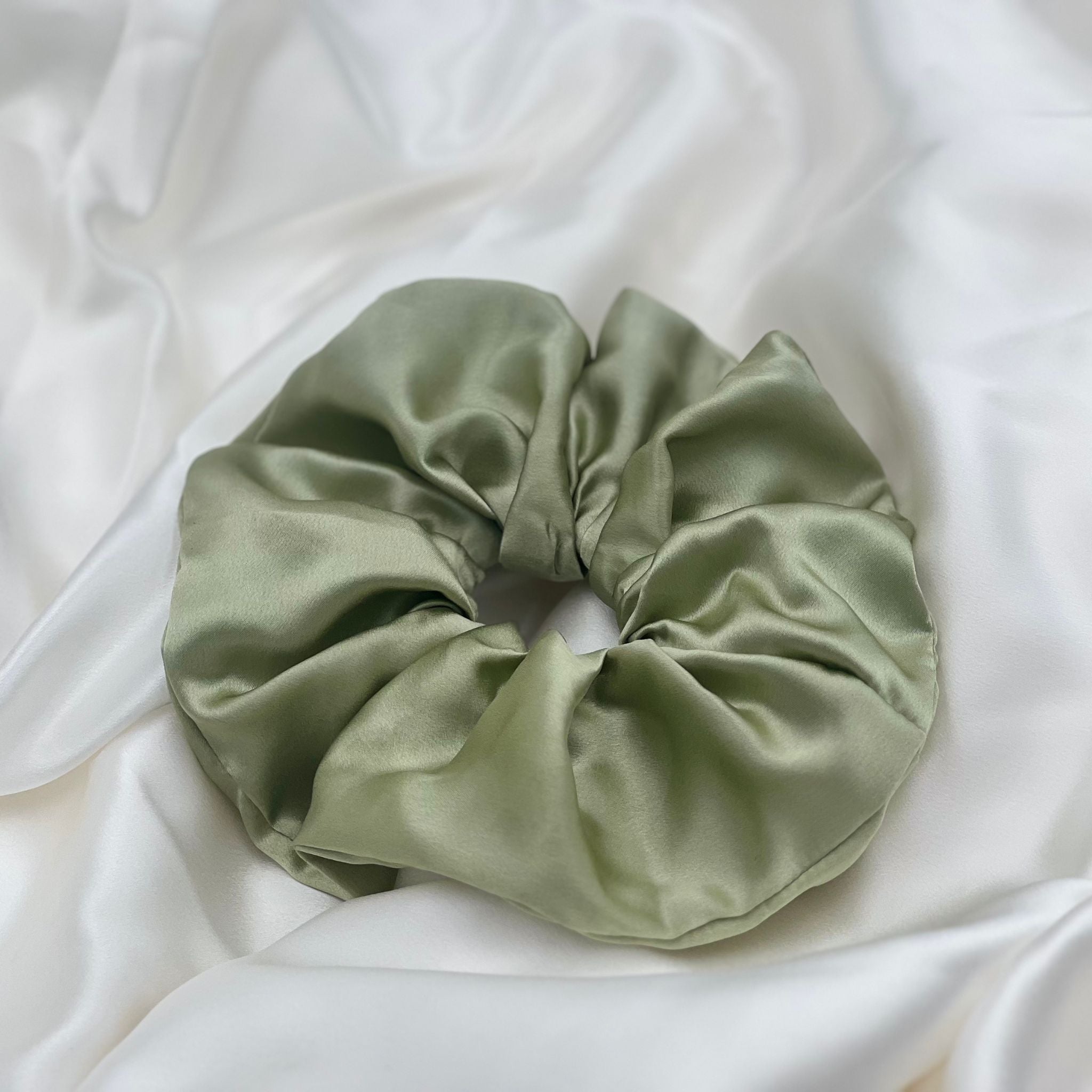 pistachio green oversized silk scrunchie on ivory silk