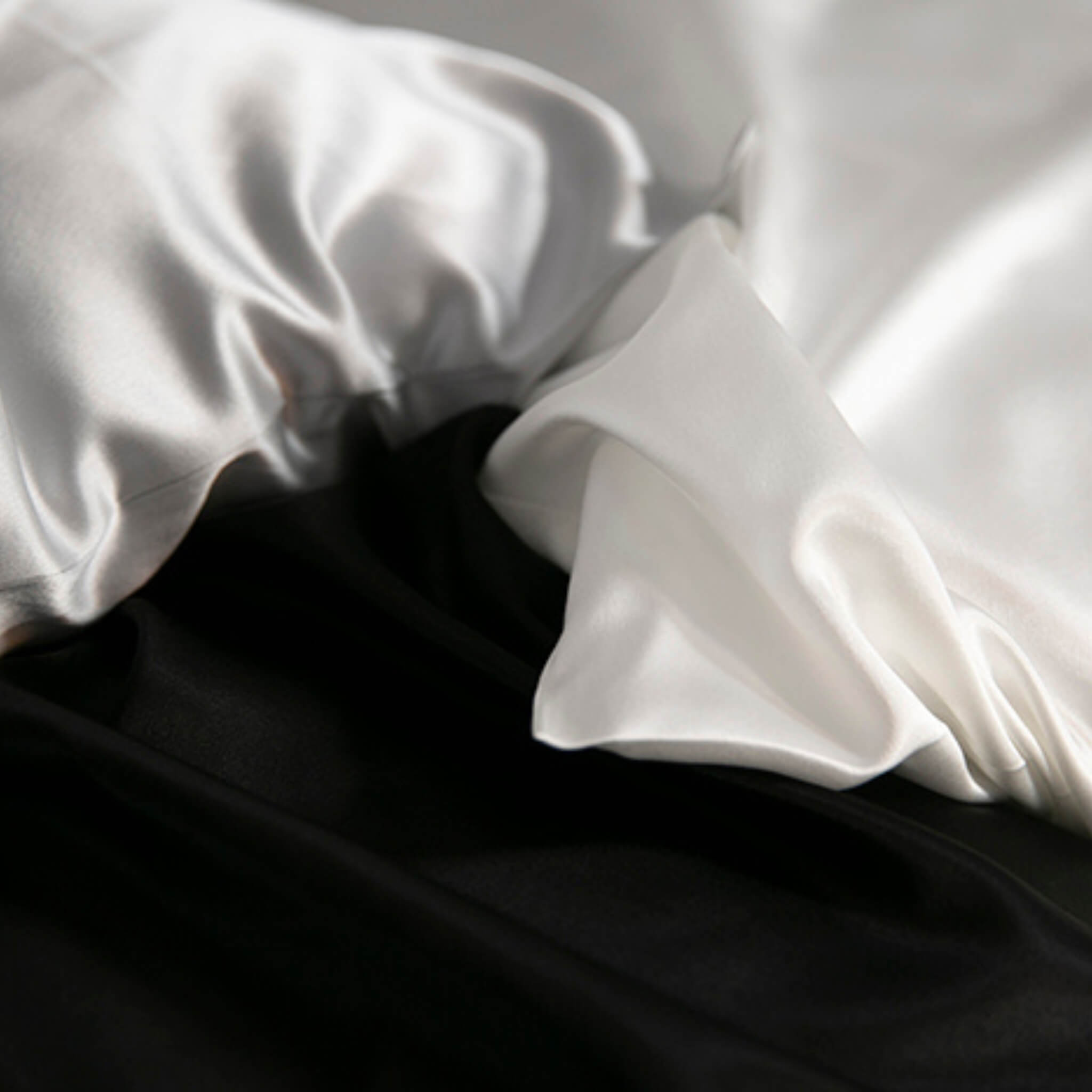 corners of silver, ivory and black 25 momme silk pillowcases