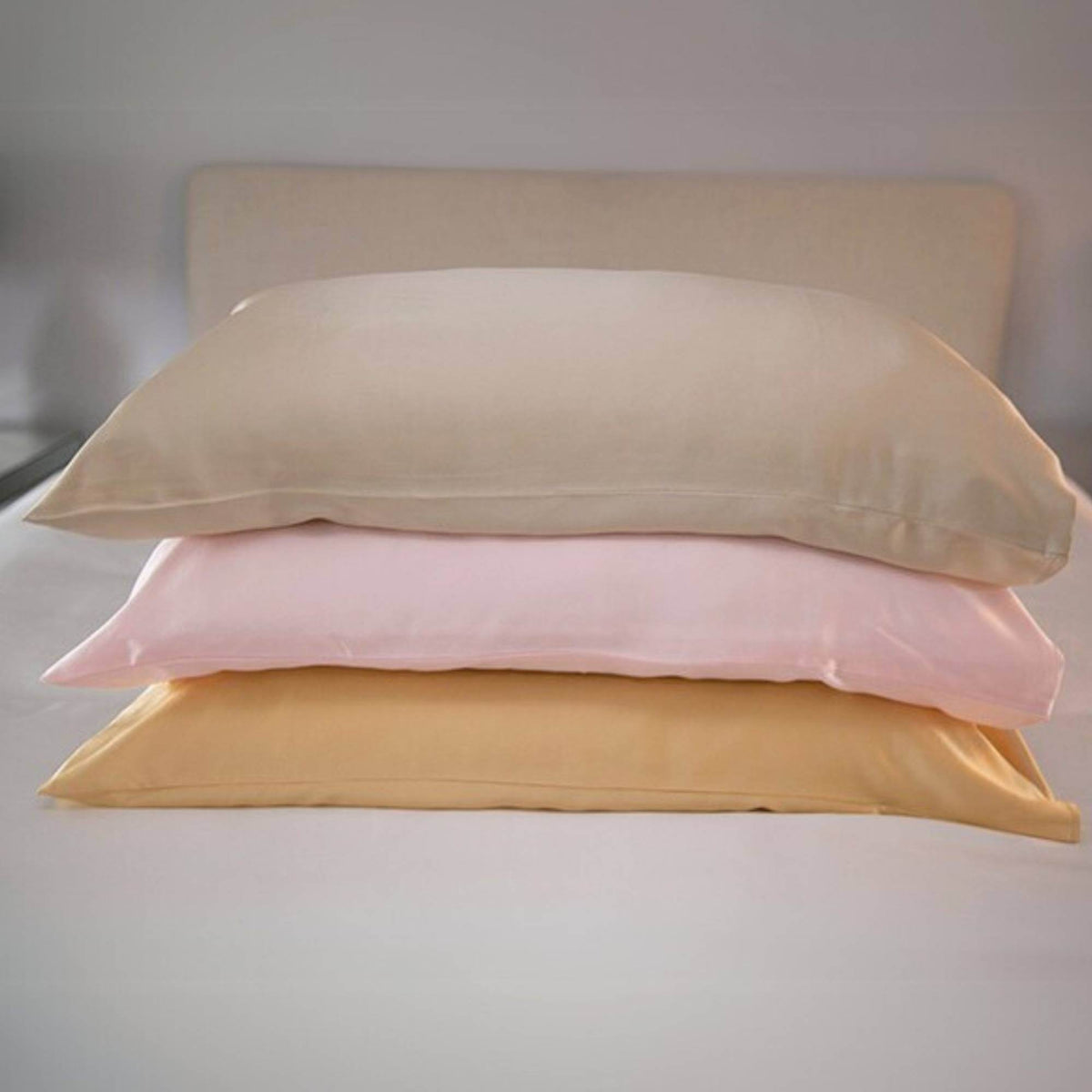 champagne, pink and gold 25 momme silk pillowcases stacked