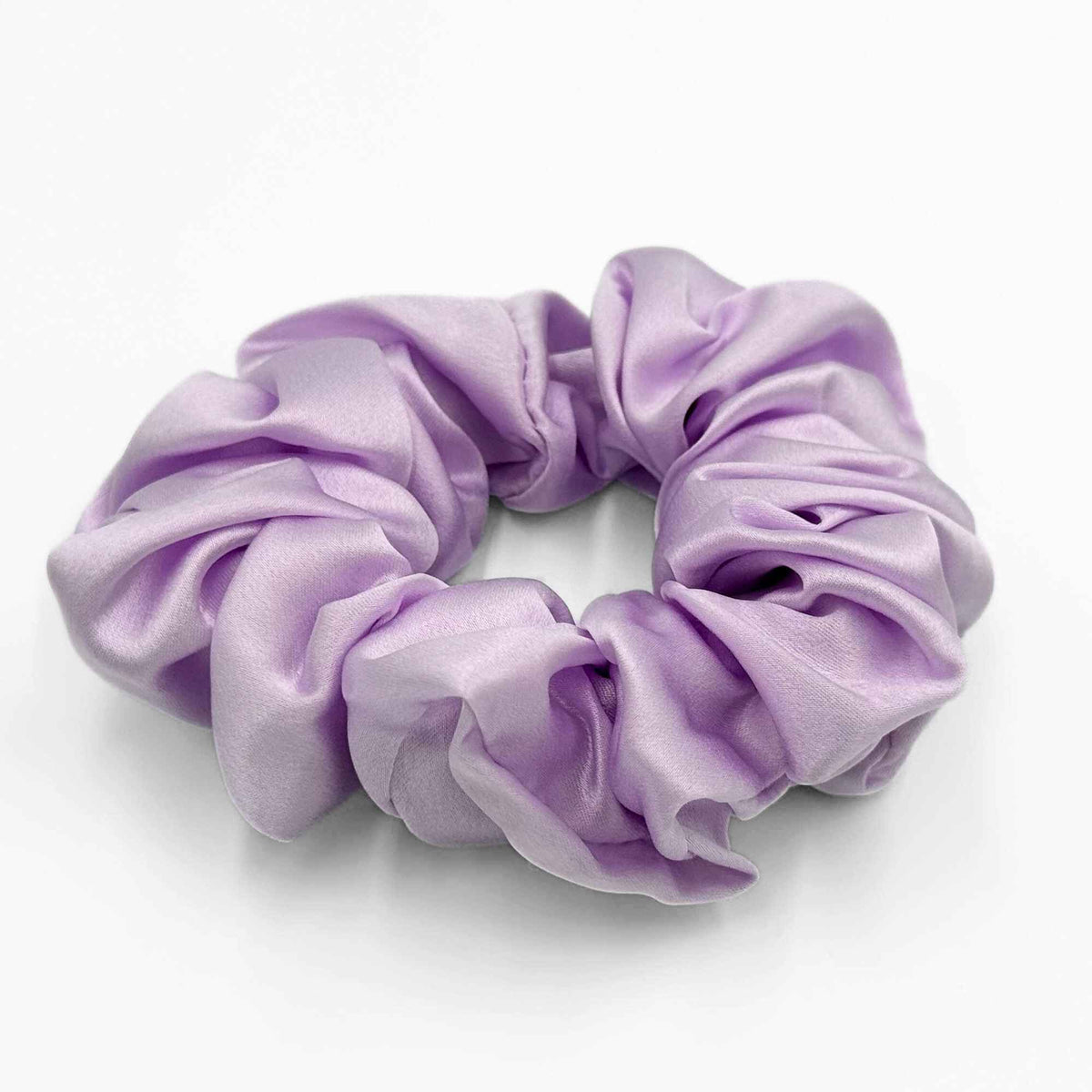 Lavender purple mulberry silk scrunchie on a white background