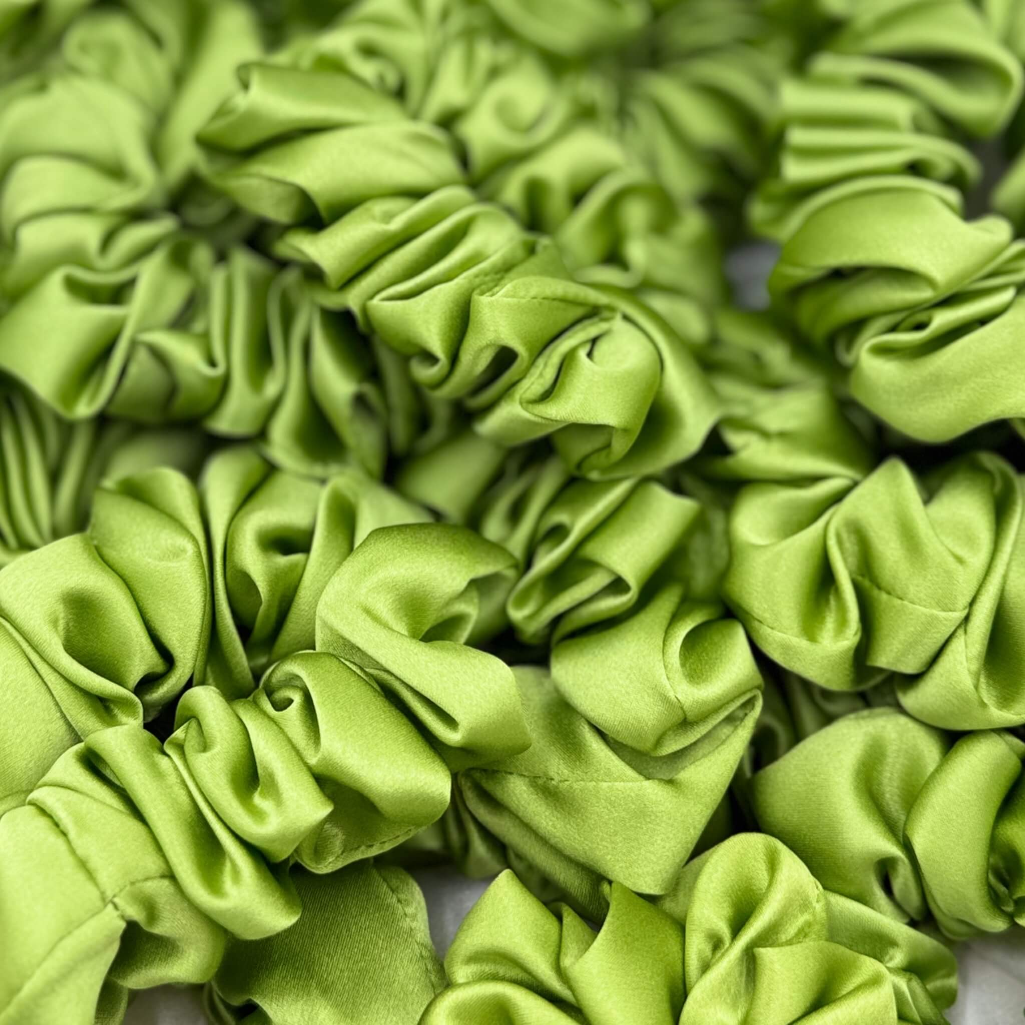 lime green silk scrunchies in a pile