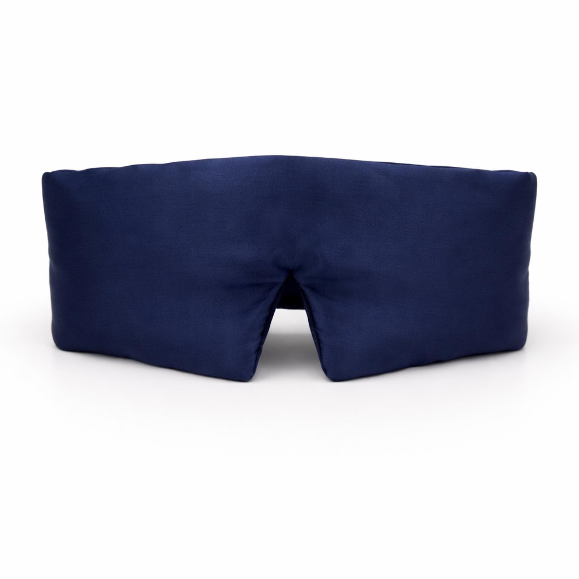 Navy blue silk eye mask on a white background