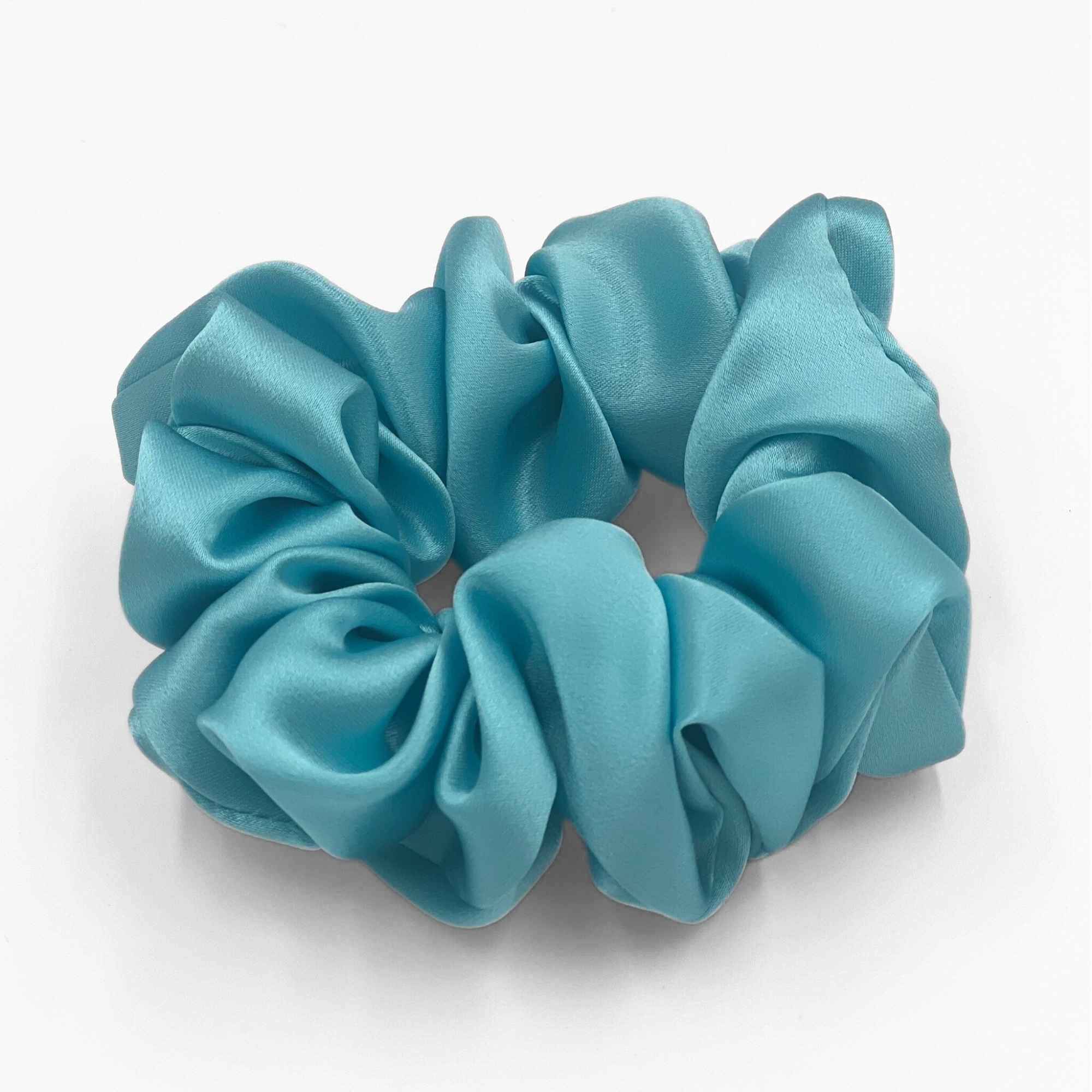 robins egg blue mulberry silk scrunchie on a light grey background