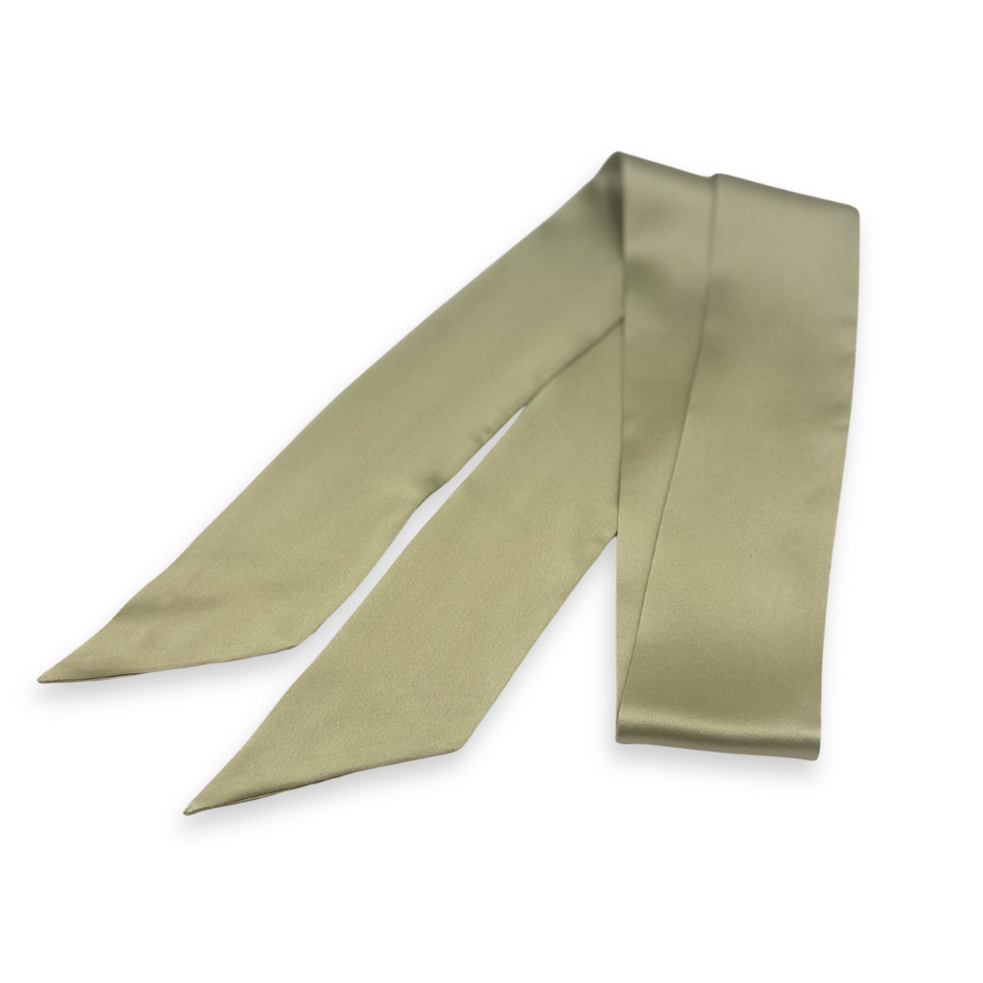 a sage green silk skinny scarf on a white background
