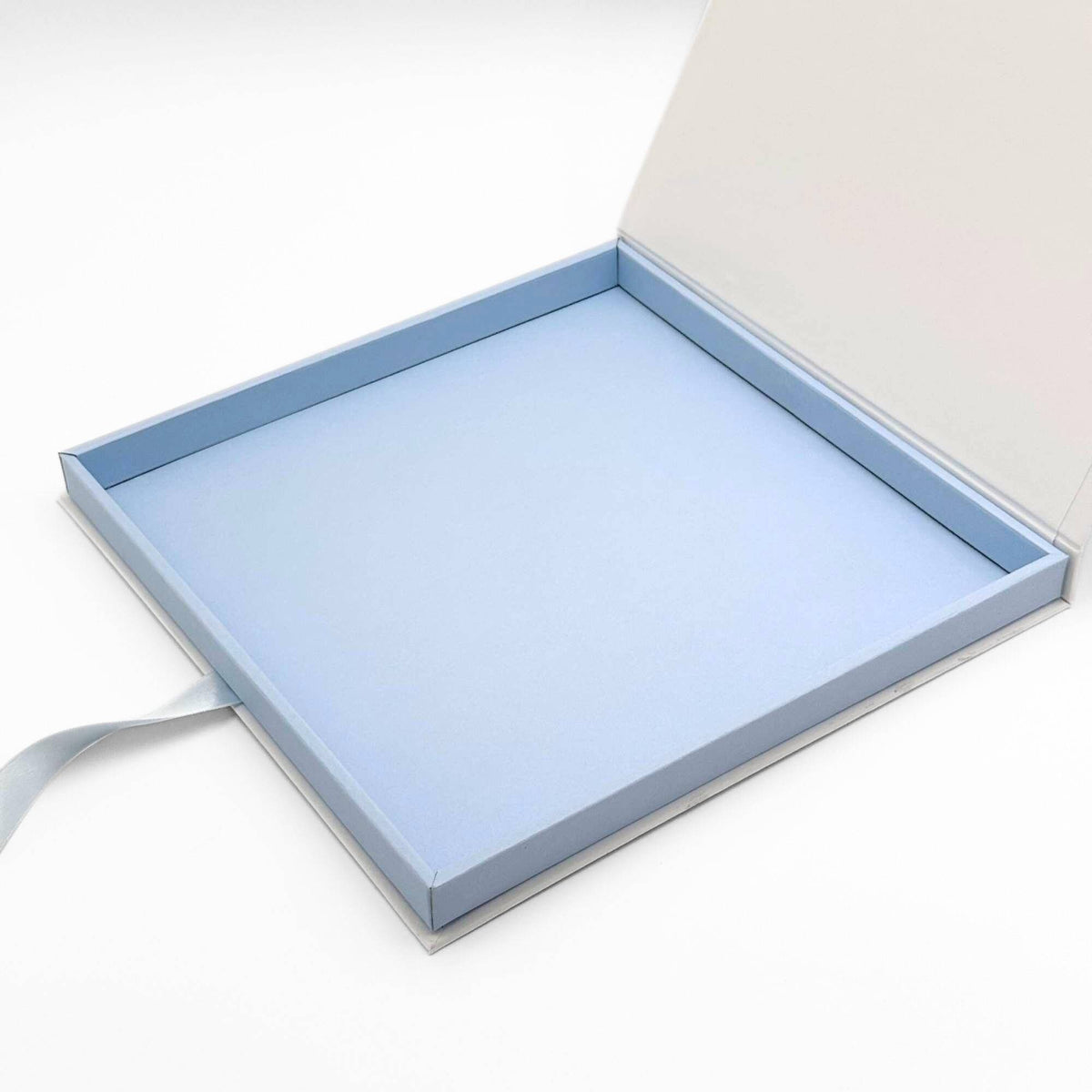 a scarf box open showing the blue lining
