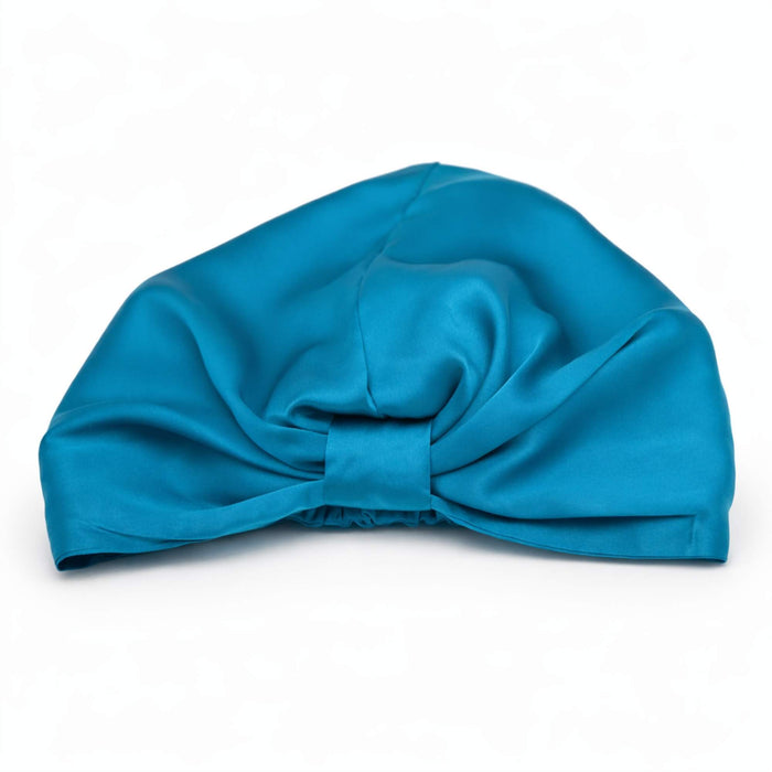 teal silk bonnet on a white backgroud