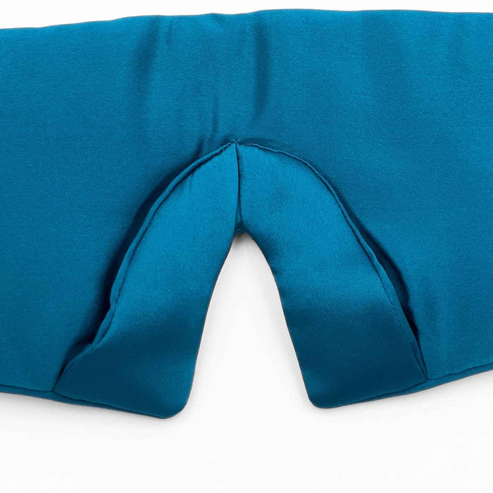 close up of the added nose area of a teal silk eye mask