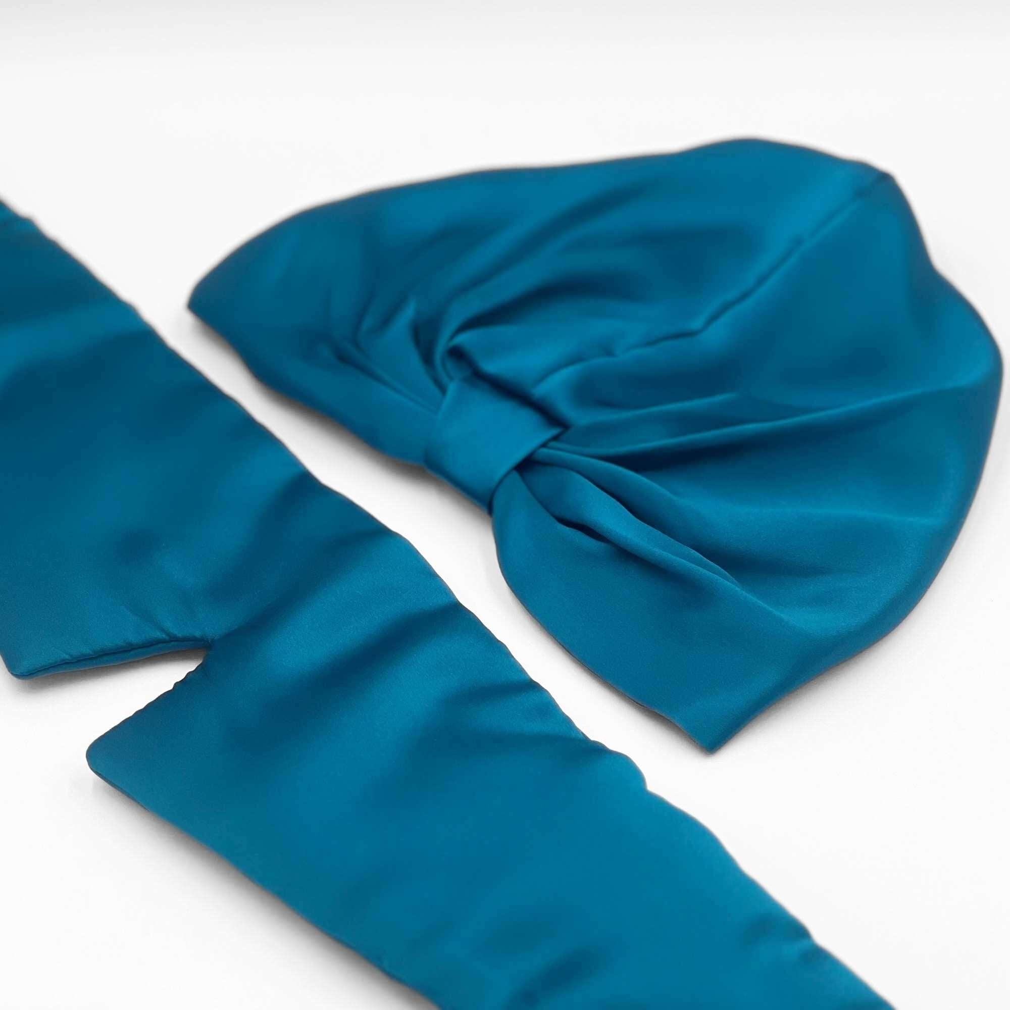 teal silk eye mask and bonnet set with the eye mask opened out to show its length