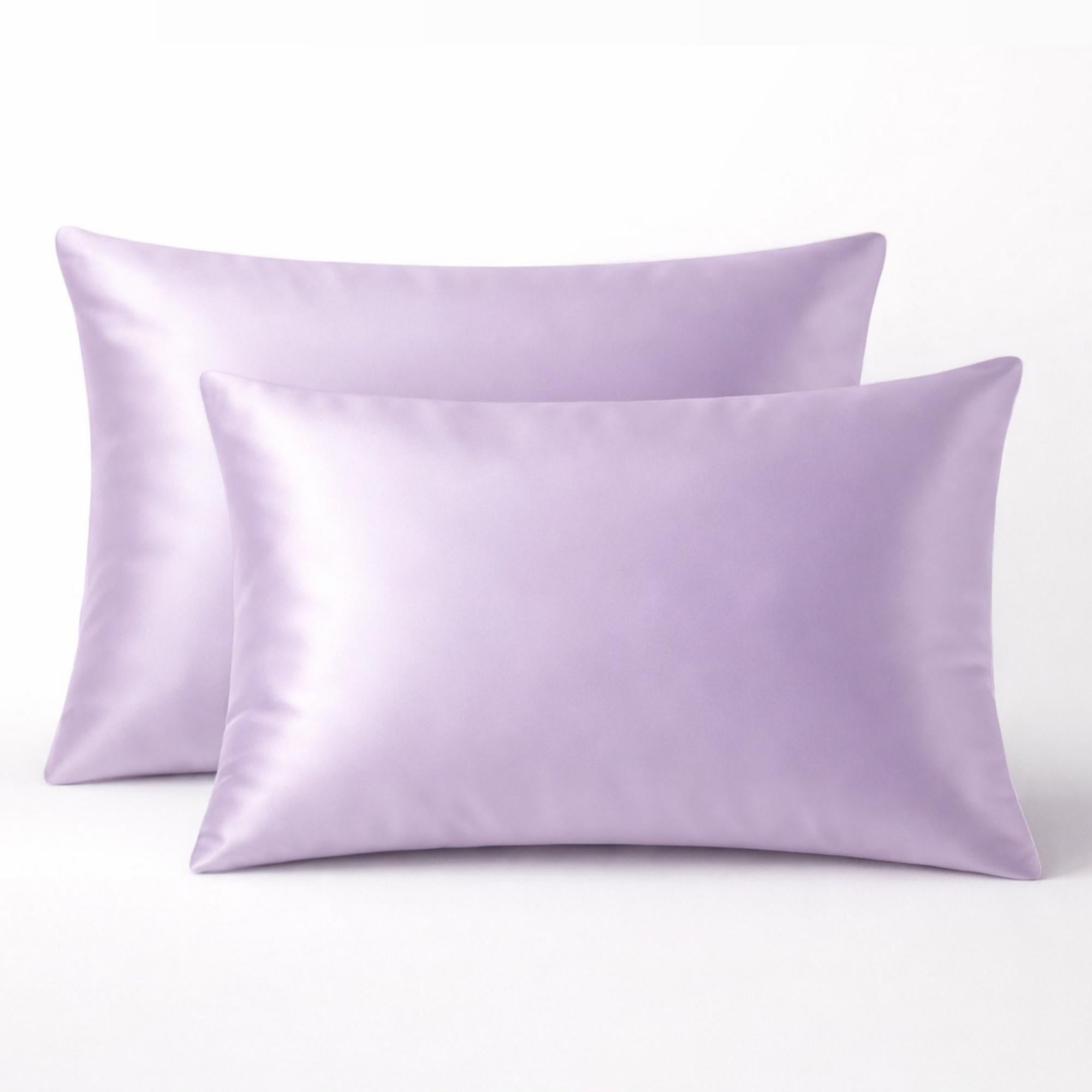 Two thistle purple silk glacé pillowcases on a white background