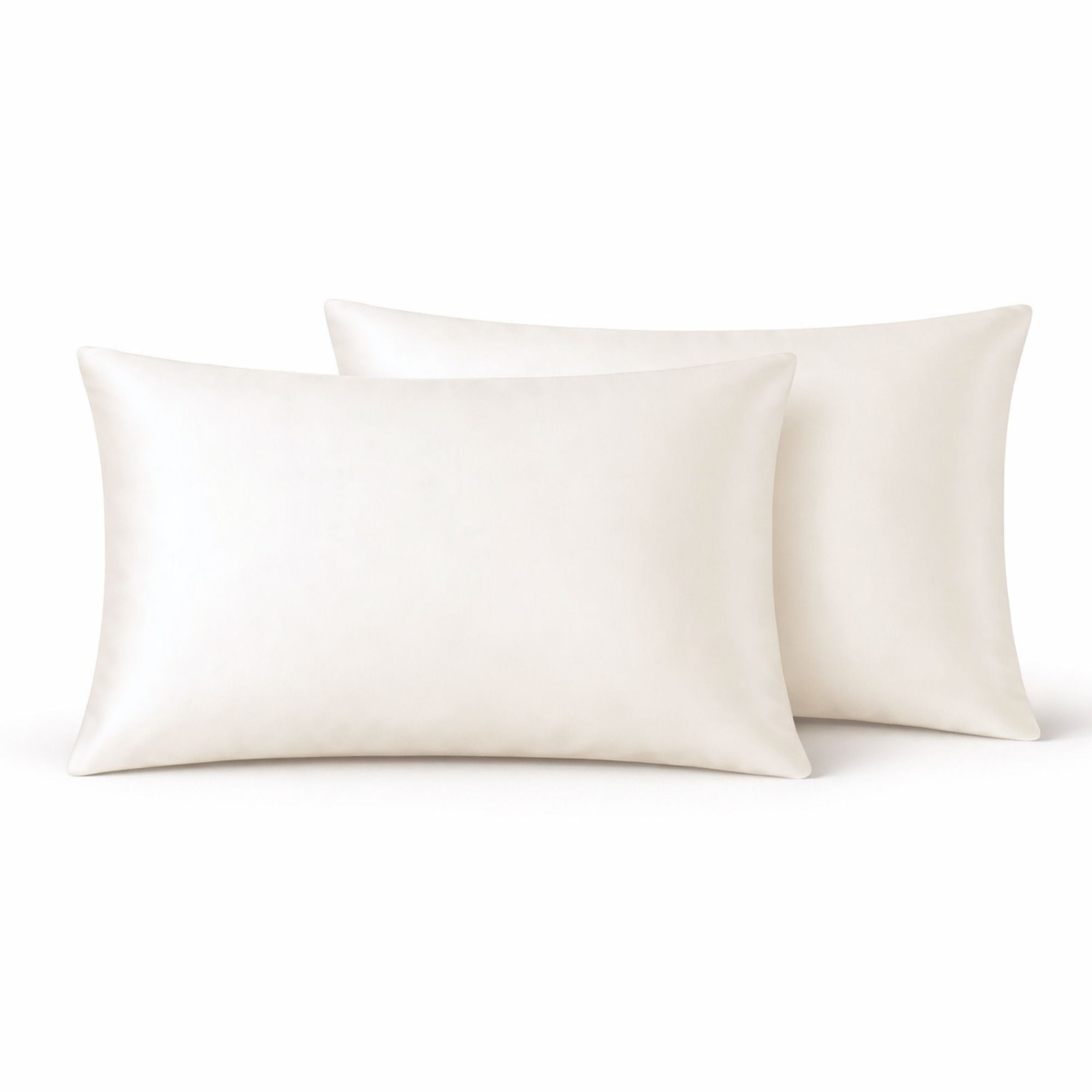 Two ivory silk pillows on a white background