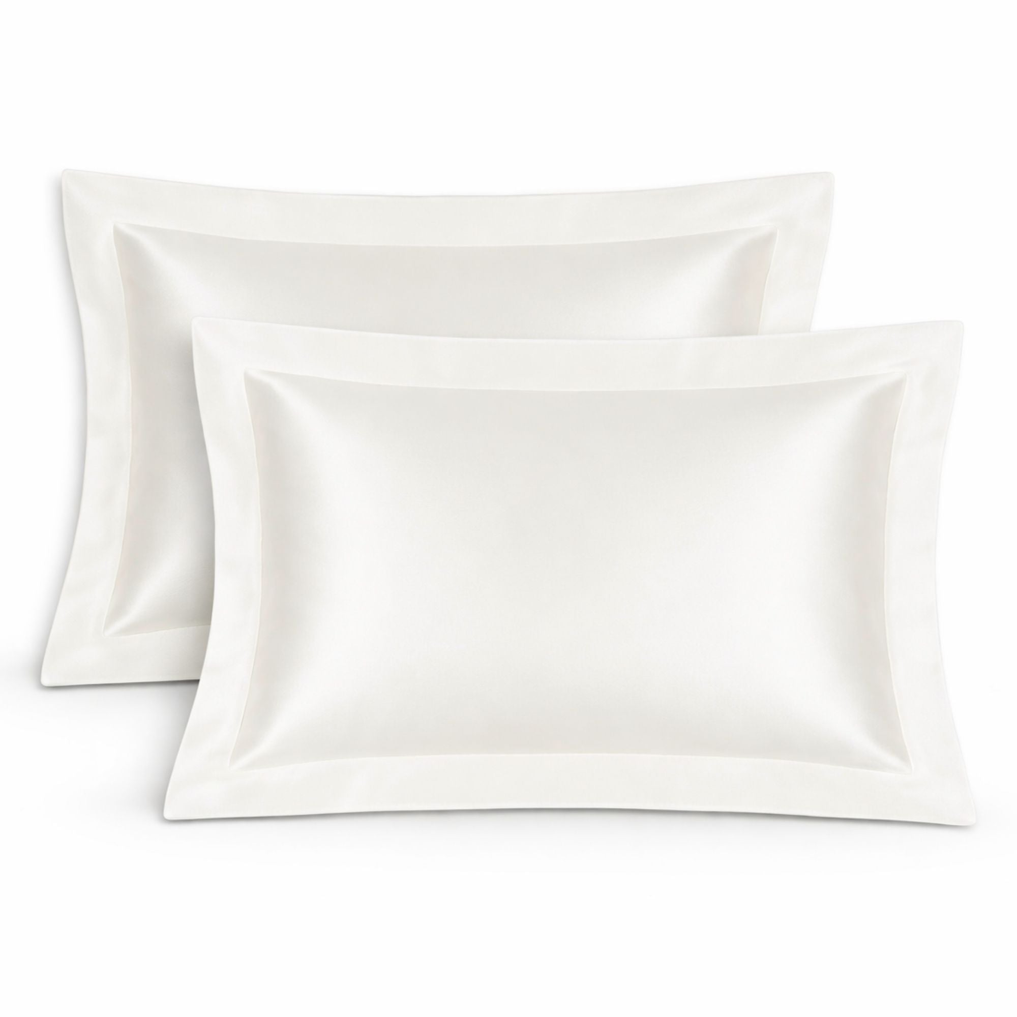 Two ivory silk oxford pillowcases on a white background