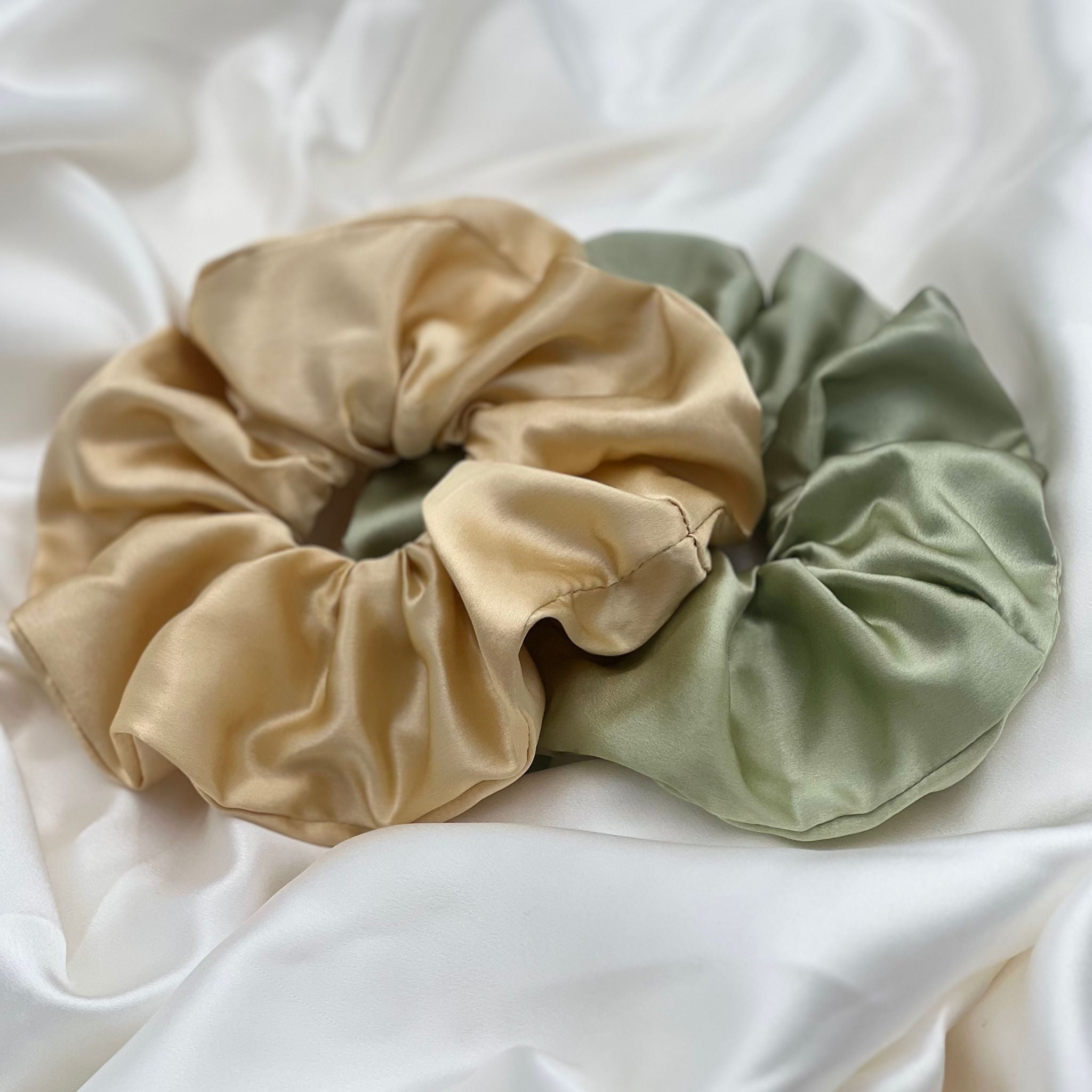 golden yellow and pistachio green oversized silk scrunchies on ivory silk