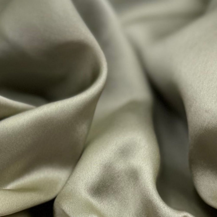 Close up of pea green silk fabric
