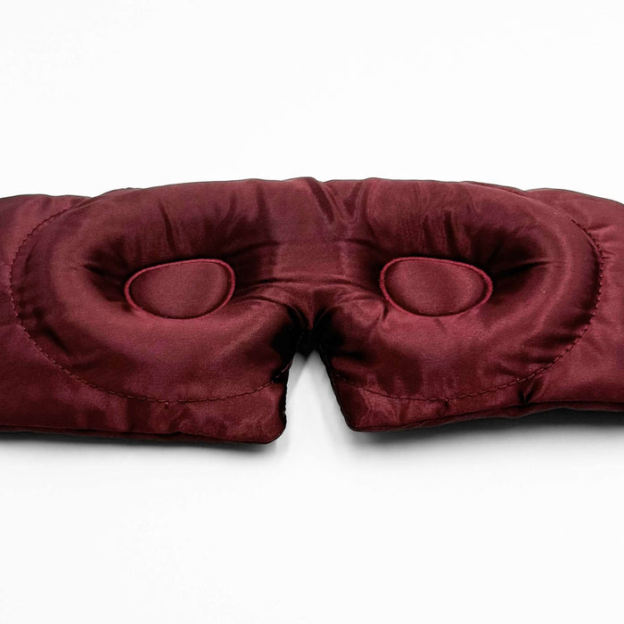 close up of the contoured eye part of a 3d burgundy silk eye mask