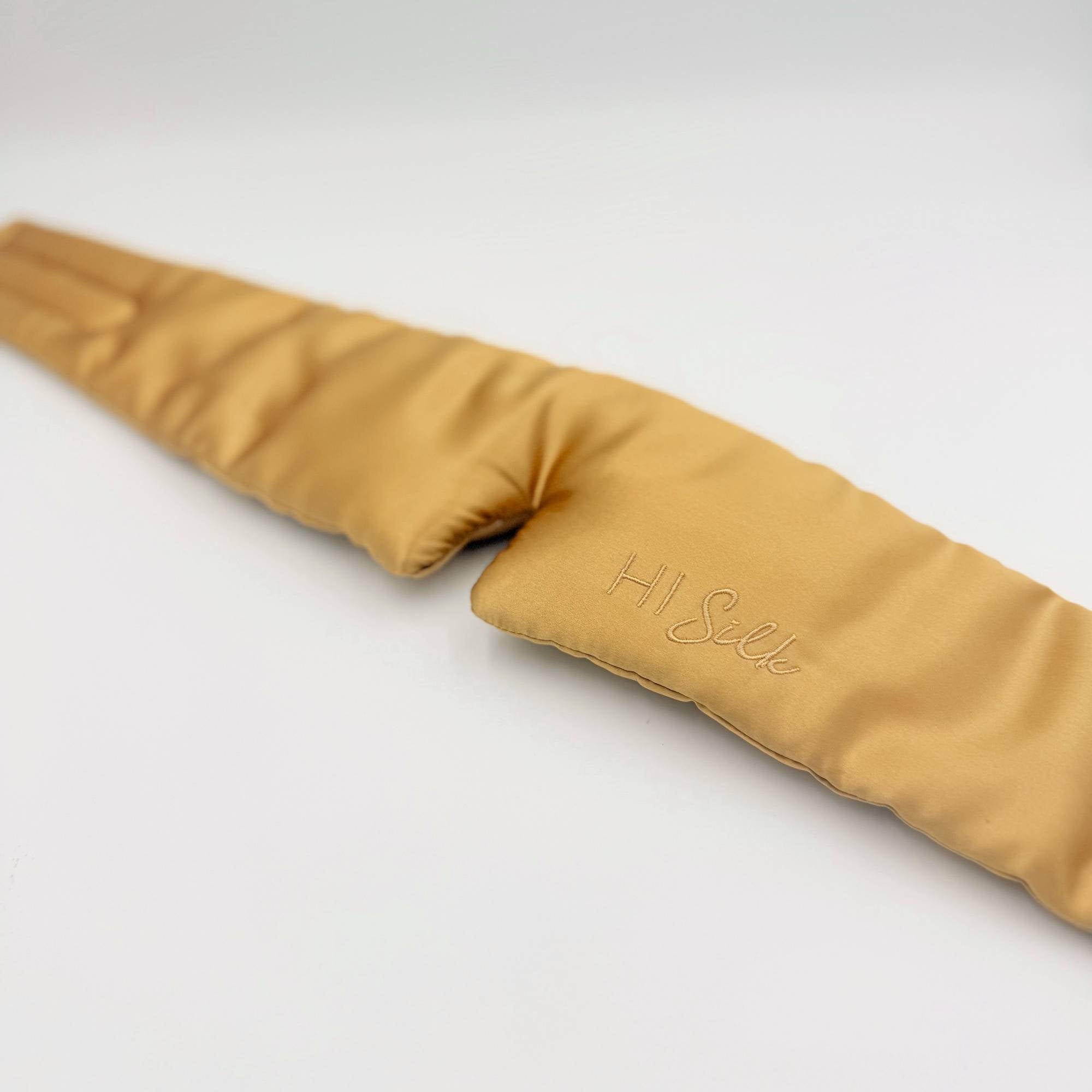 Honeycomb coloured 3d silk eye mask lying flat on a white background