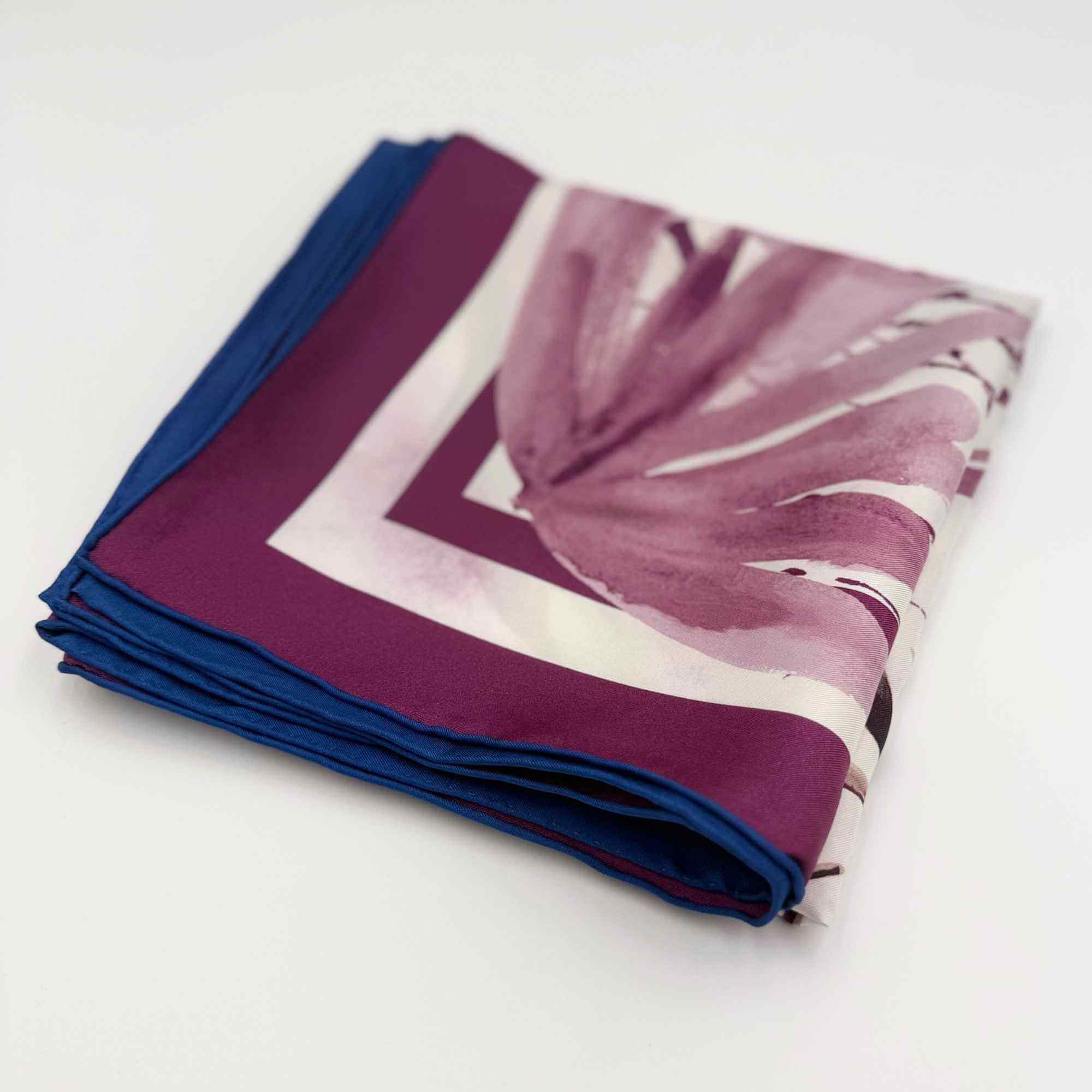 Folded 'Beautiful Botanicals' silk twill scarf on a white background