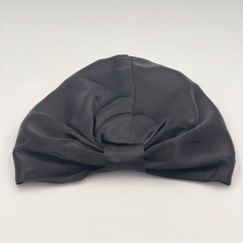 Black silk bonnet laying flat