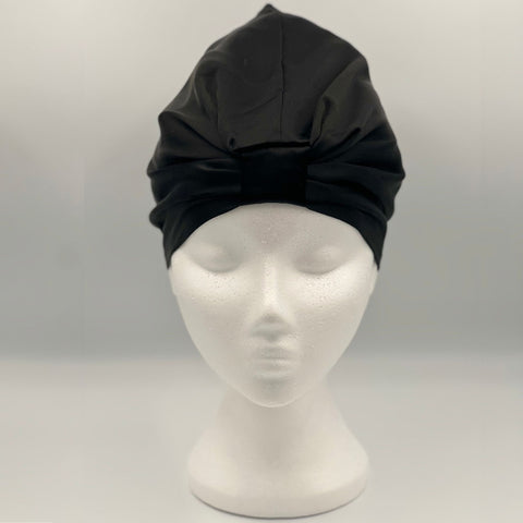 Front view of a black silk bonnet on a mannequin