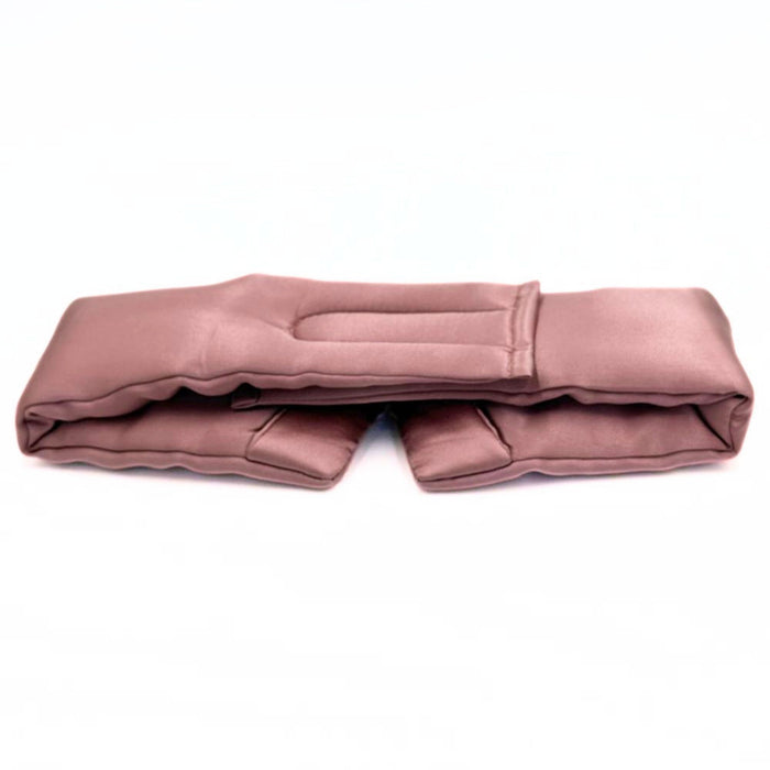 the back of an adjustable dusty pink eye mask