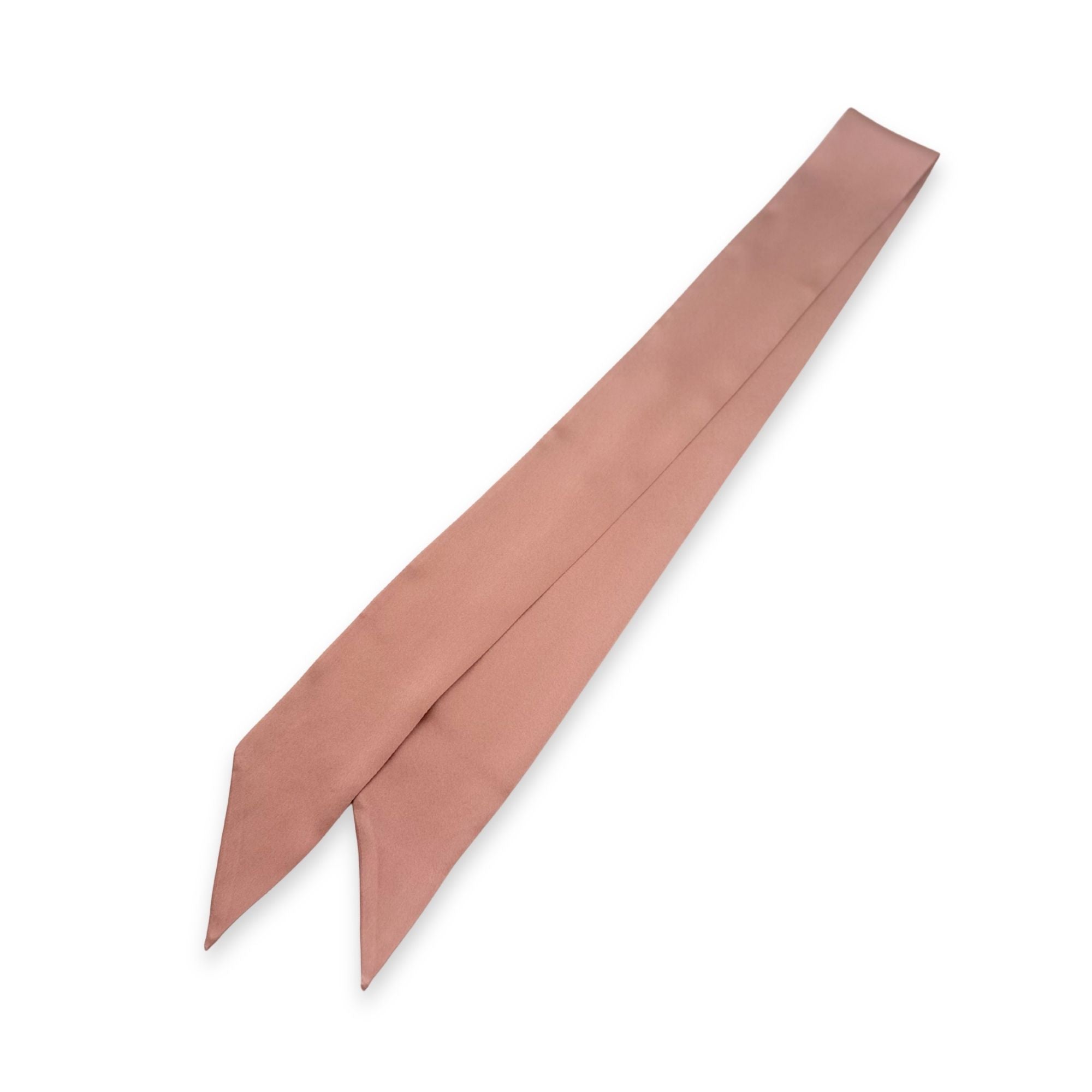 a dusty rose silk skinny scarf on a white background