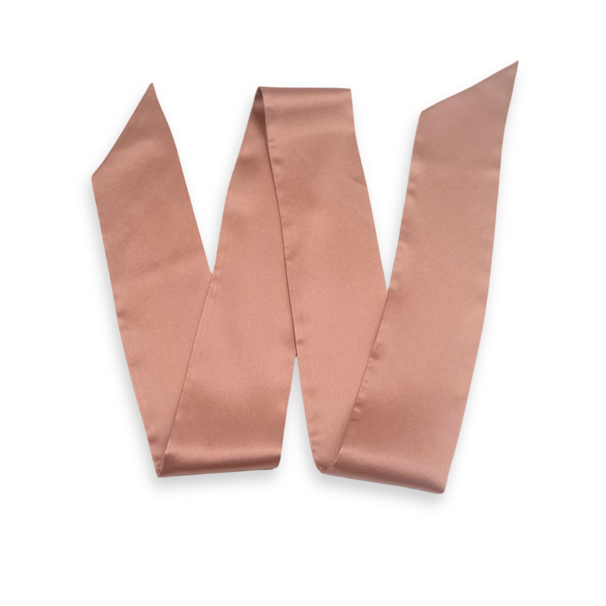 a dusty rose silk skinny scarf on a white background