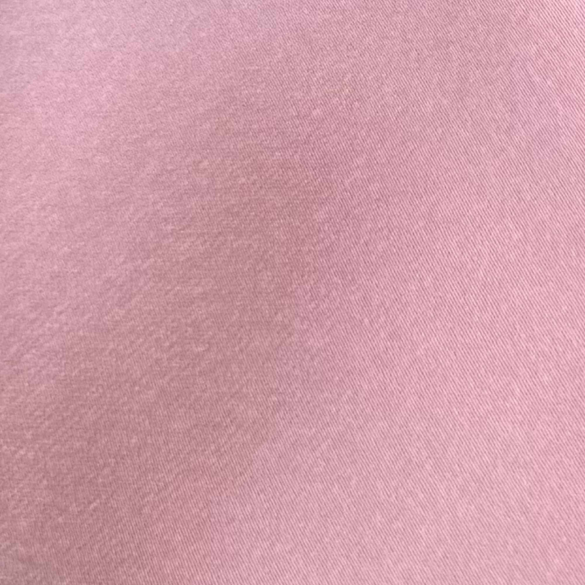 Close-up of dusty rose pink silk fabric texture