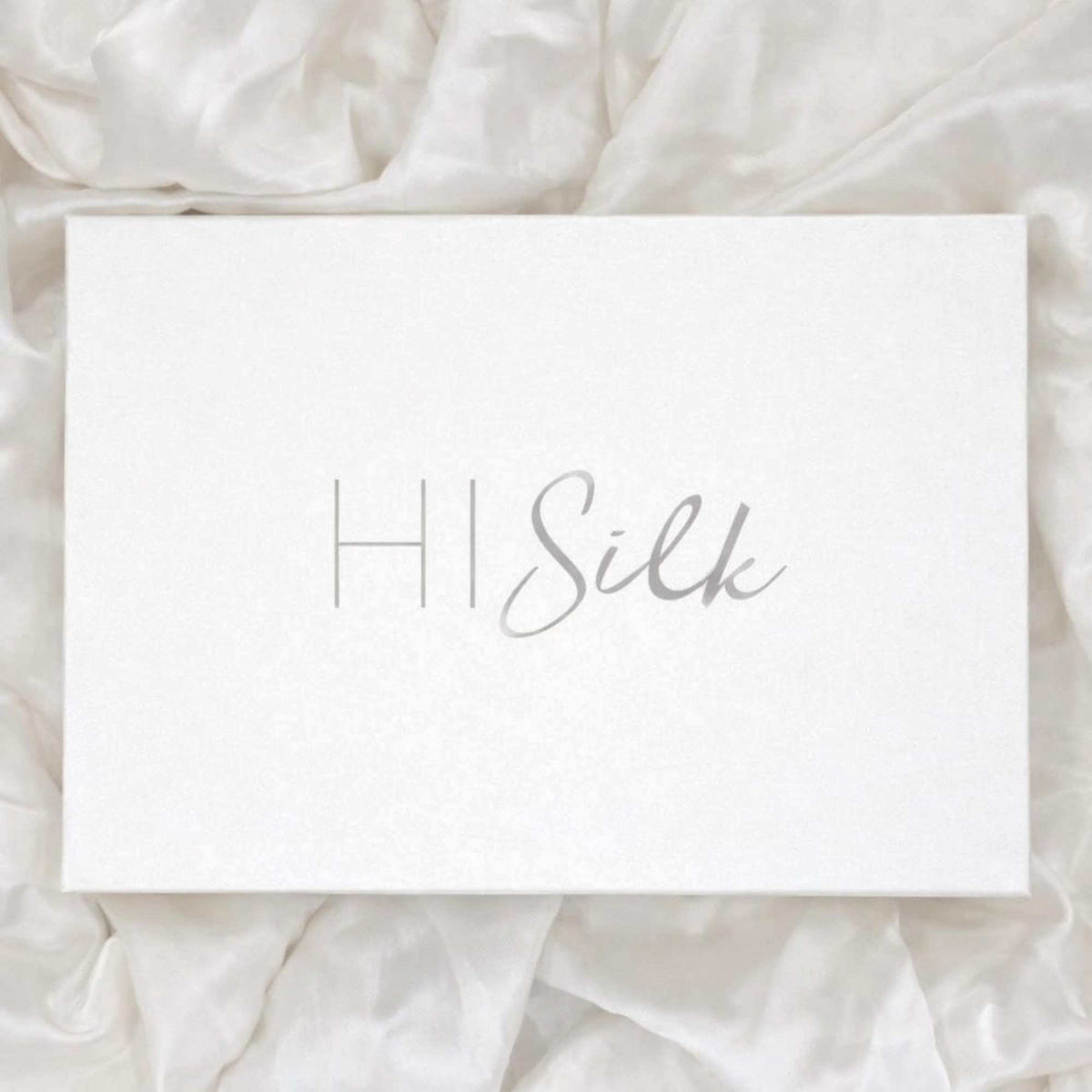 a white box with the word HI Silk written on it in silver text