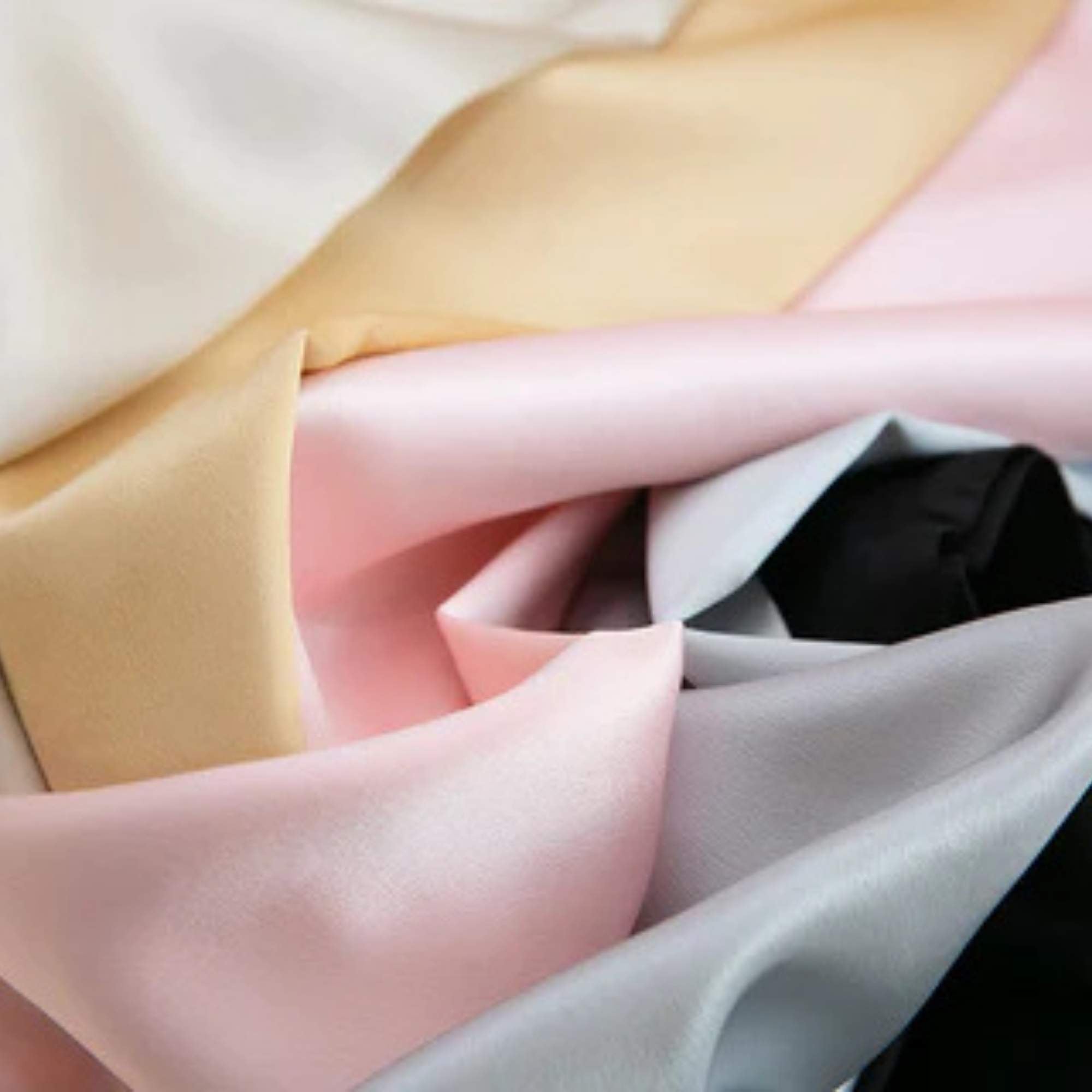black, gold, silver, pink and champagne 25 momme silk pillowcases scrunched together