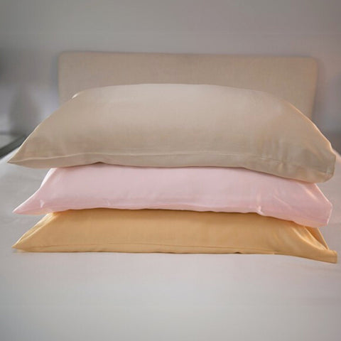 champagne, pink and gold 25 momme silk pillowcases stacked