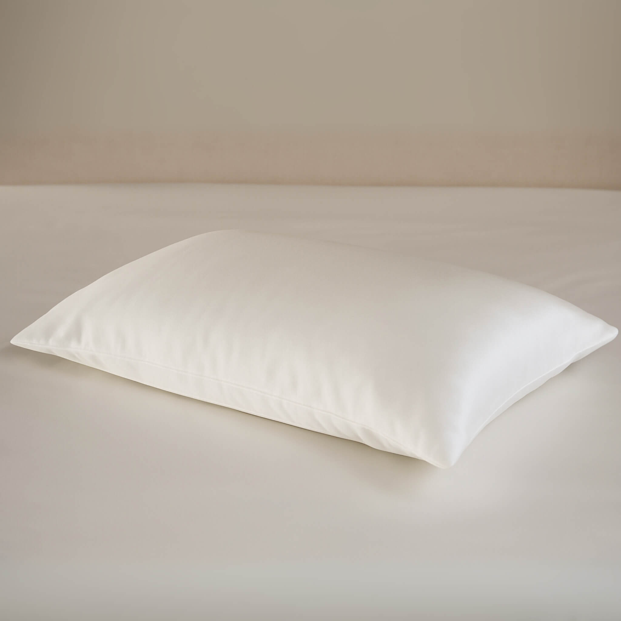 Ivory silk pillowcase on an ivory silk bed sheet