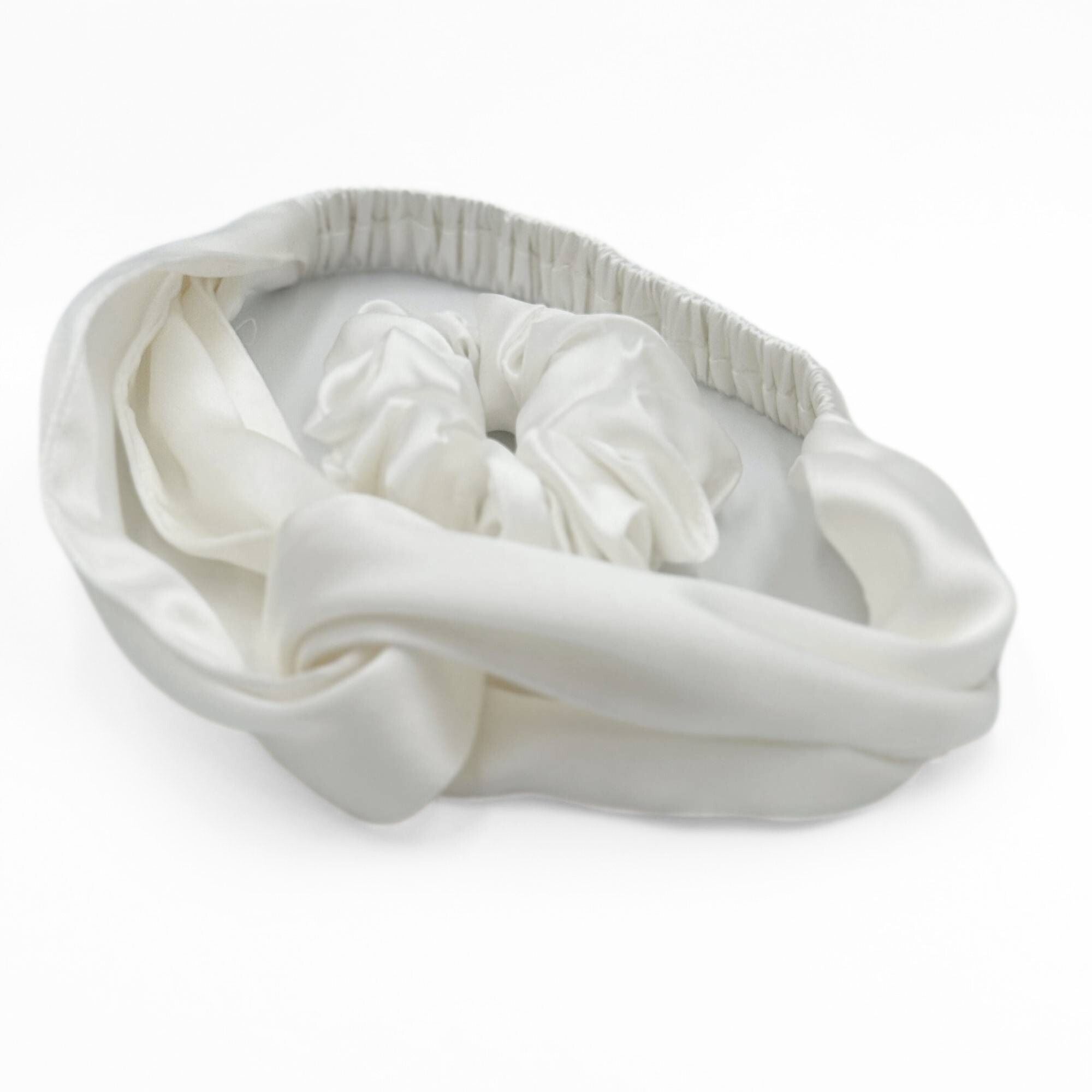 an ivory white silk scrunchie and headband on a white background