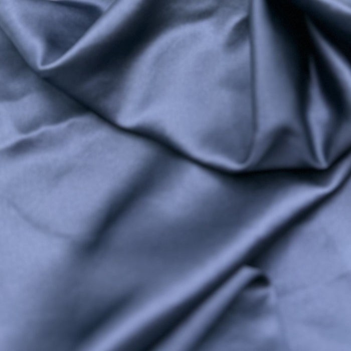 Close-up of blue silk fabric with folds