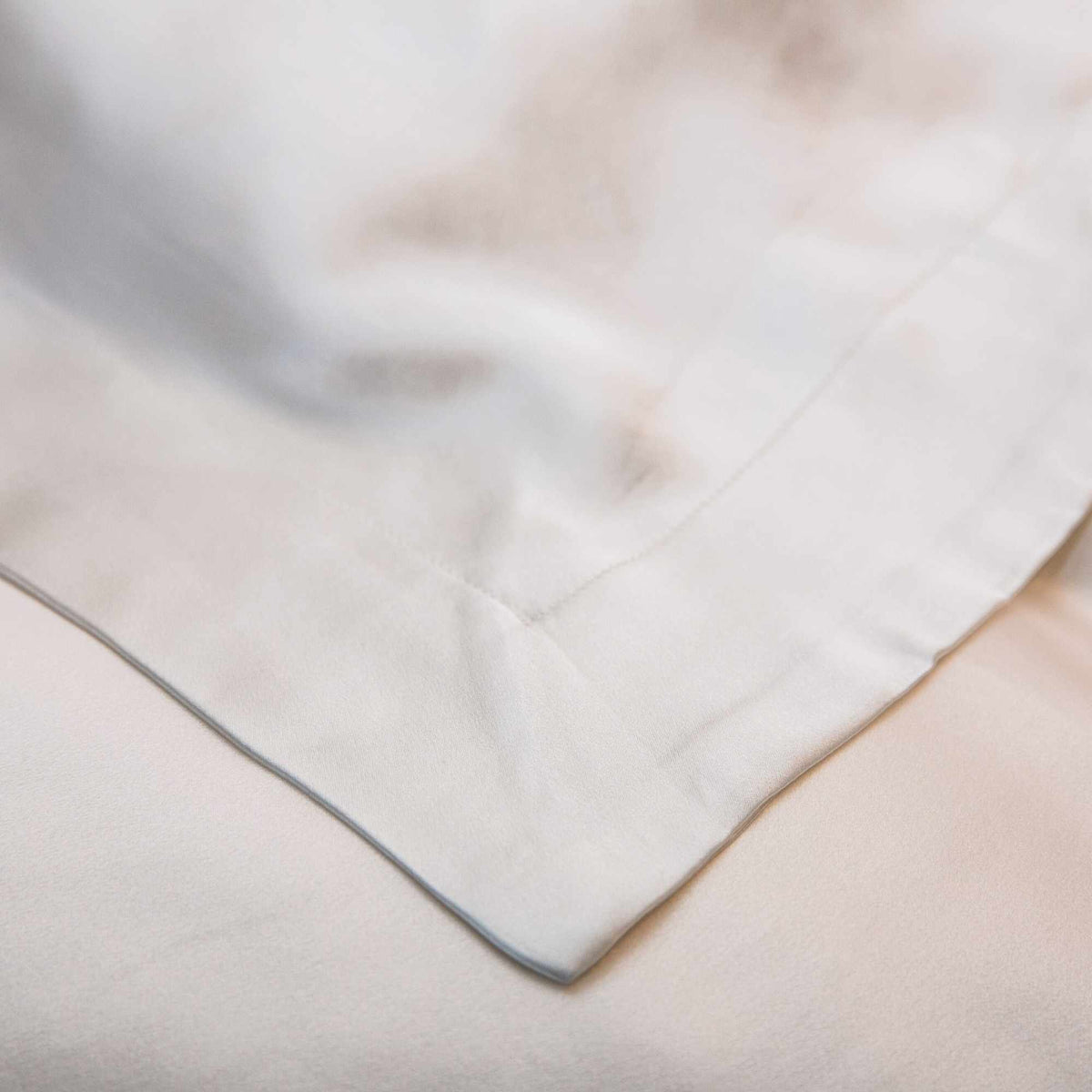 close up of the corner of the flange on the oxford mulberry silk pillowcase