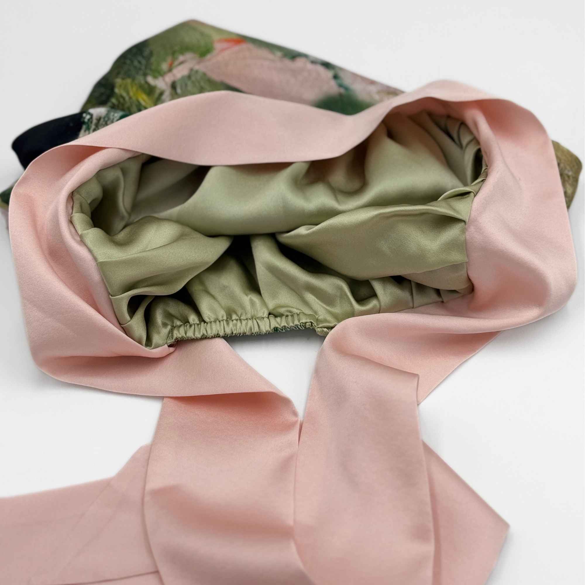 showing the reversibility of the mulberry silk tie bonnet