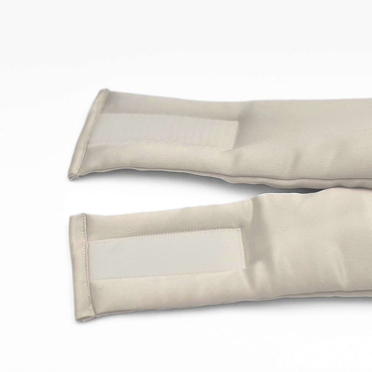 the adjustable strap of the pebble beige mulberry silk sleep mask