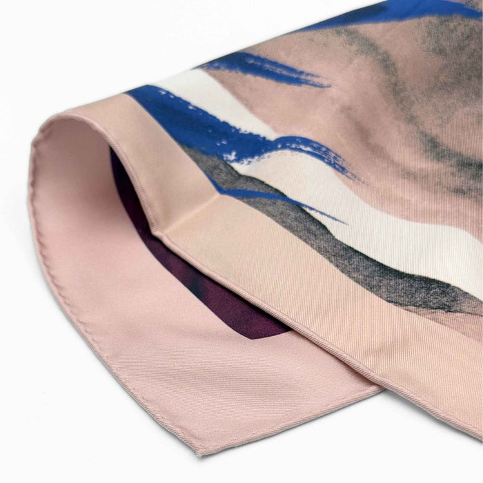 Folded silk twill with abstract design on a white background