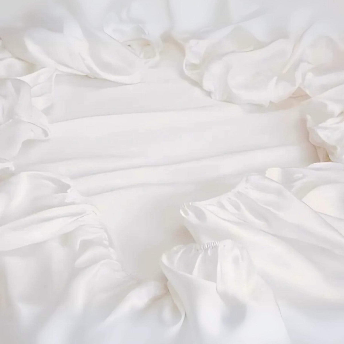 fitted silk sheet not on a bed but showing it's elastication