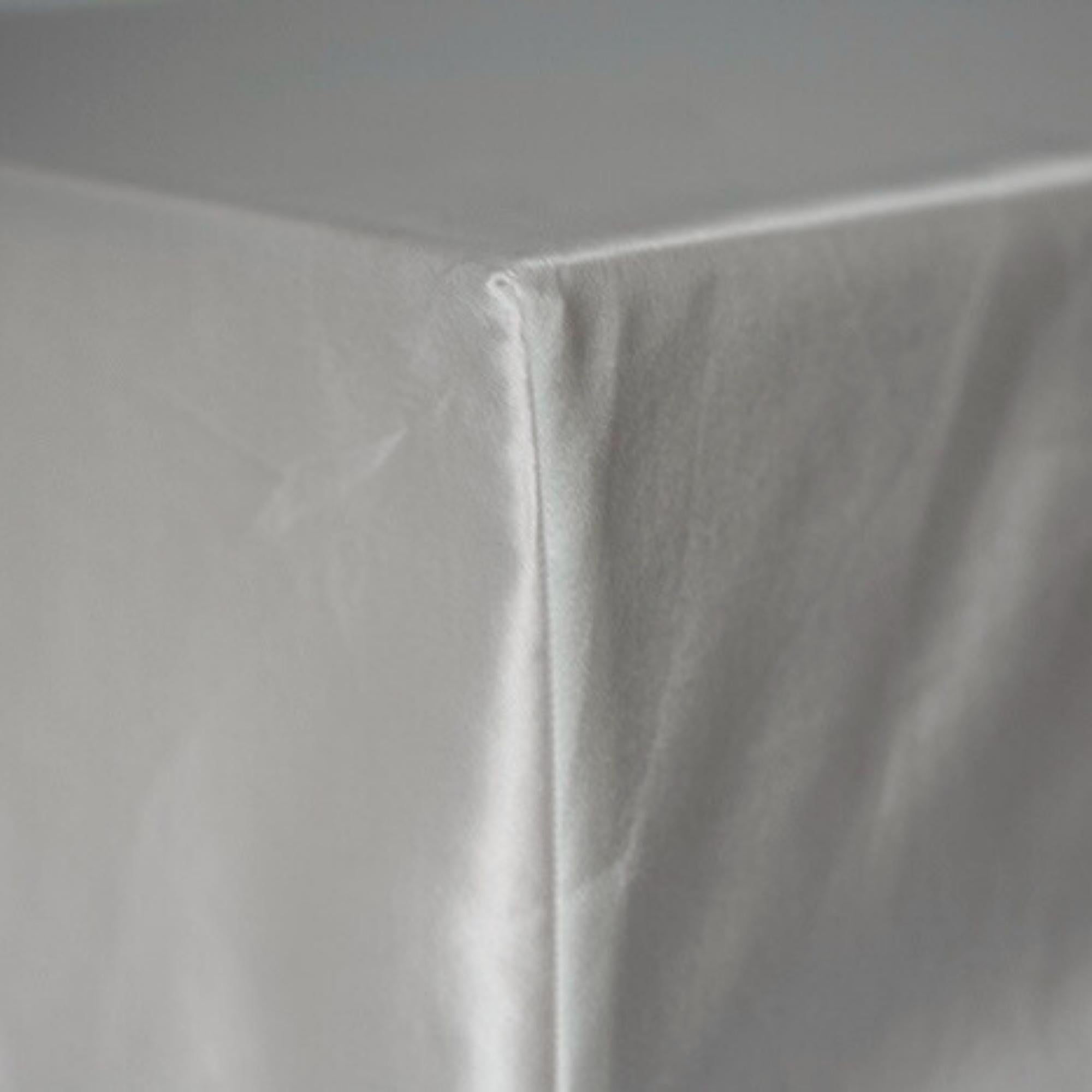 corner of a fitted silk sheet