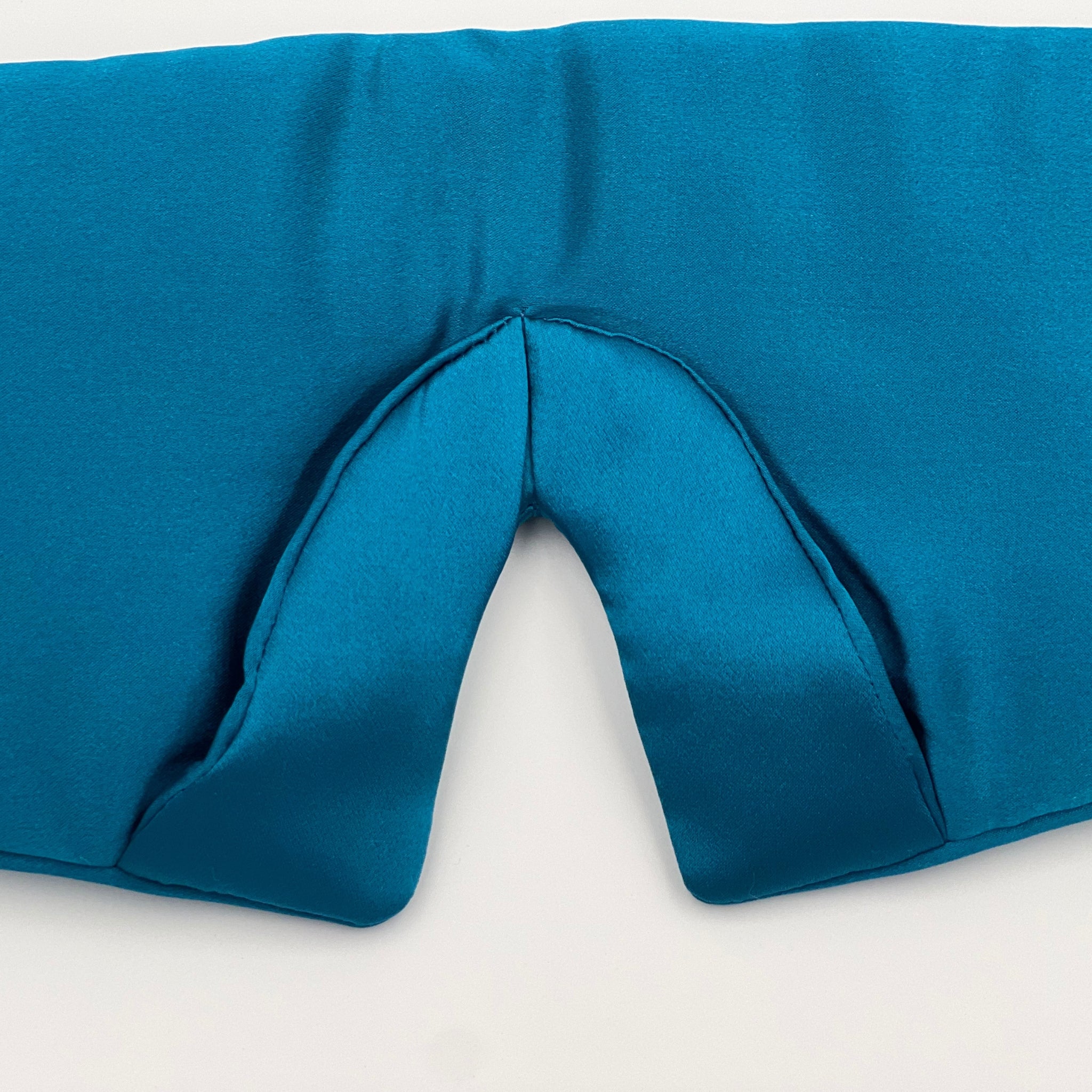 close up of the added nose area of a teal silk scrunchie