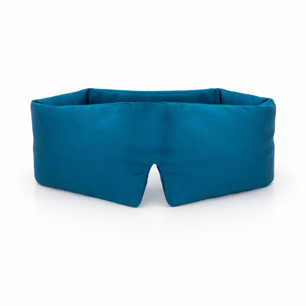 Teal blue silk sleep mask on a light gray background