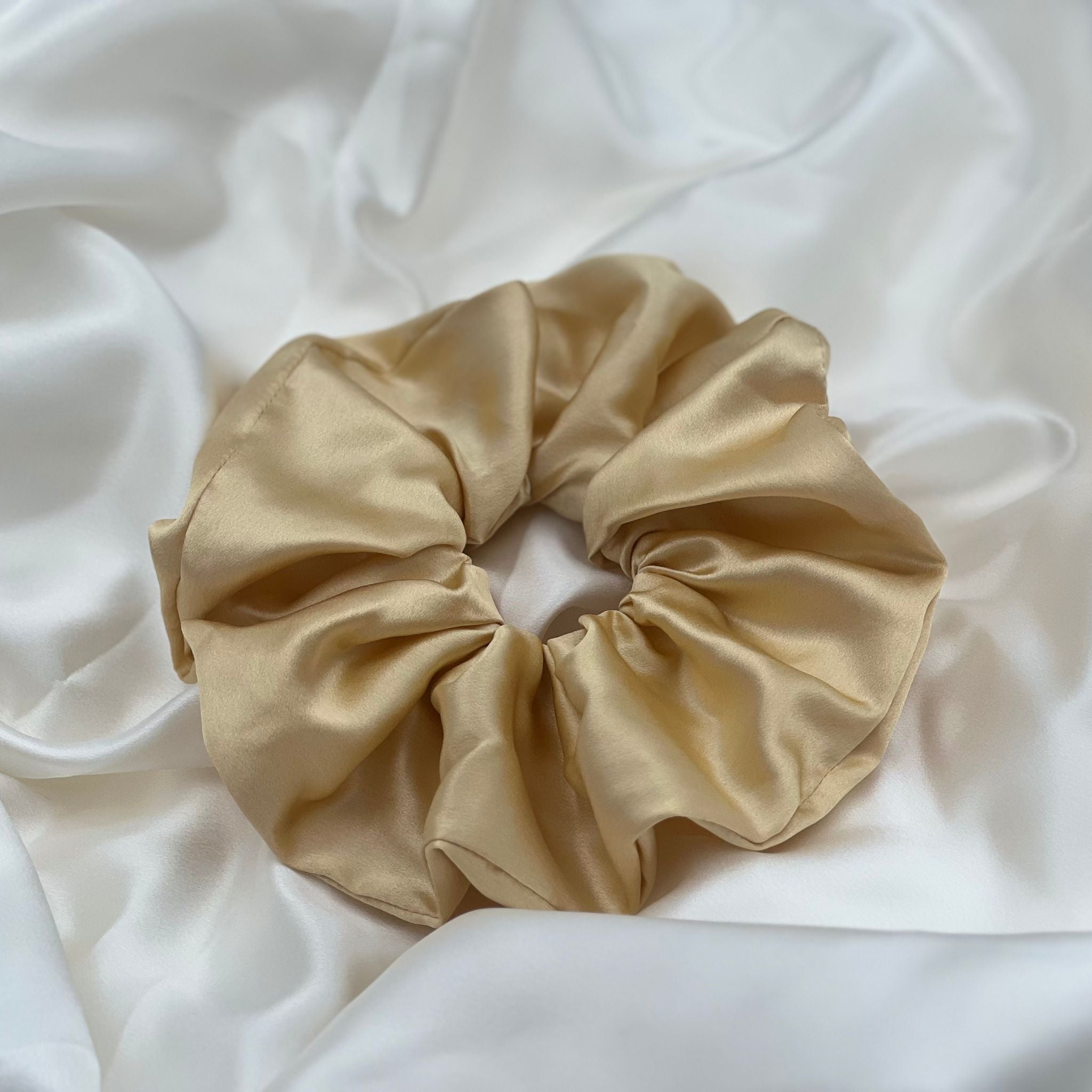 golden yellow oversized silk scrunchie on ivory silk